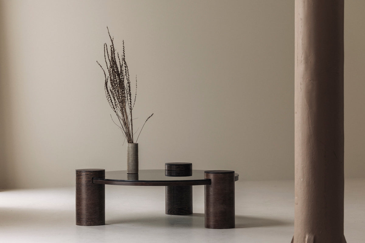 Sculptural Brutalist Wengé and Smoked Glass Round Coffee Table, 1970s by Modern Living | The Oblist