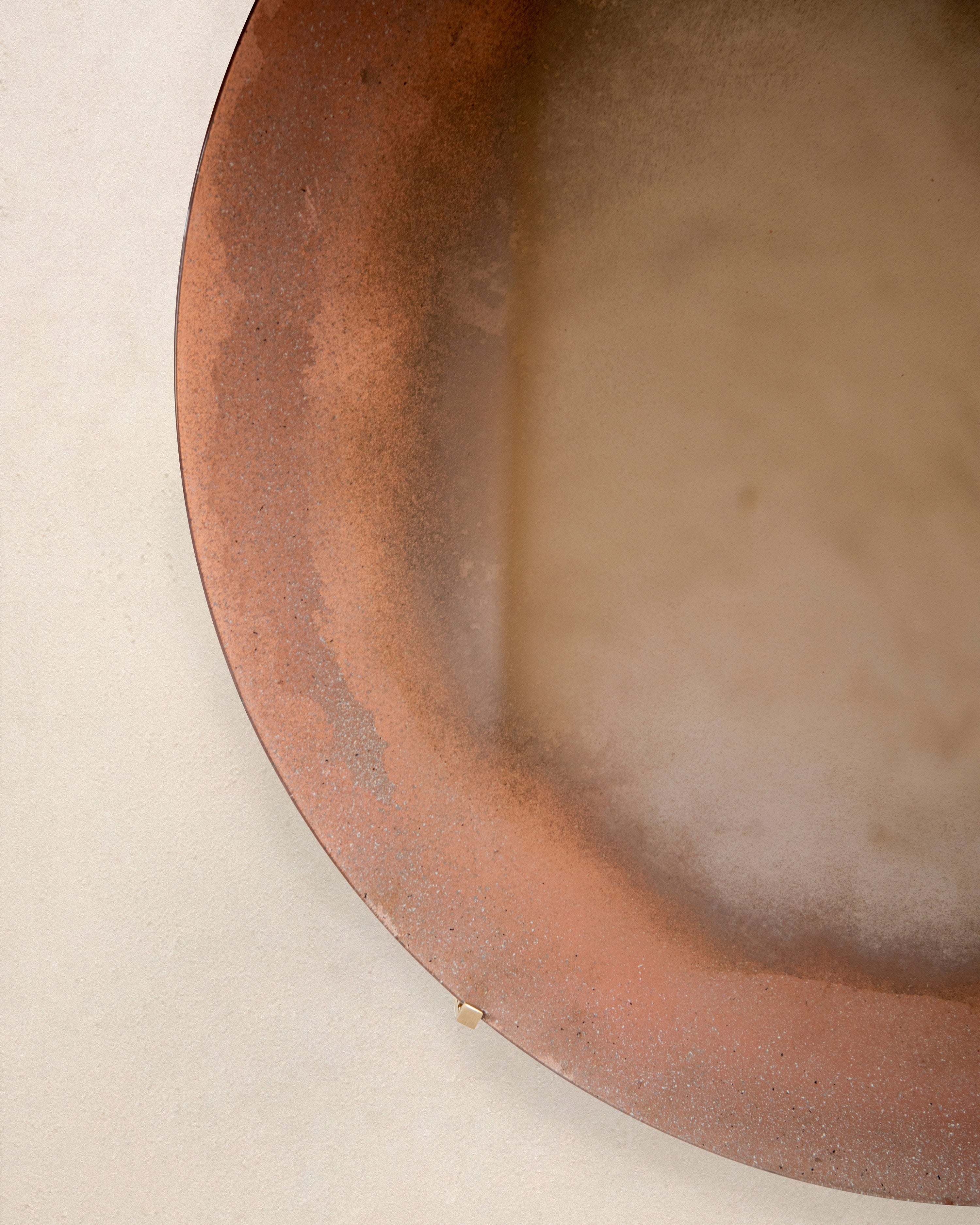 Sandstorm' Mirror — close-up of textured bronze edge