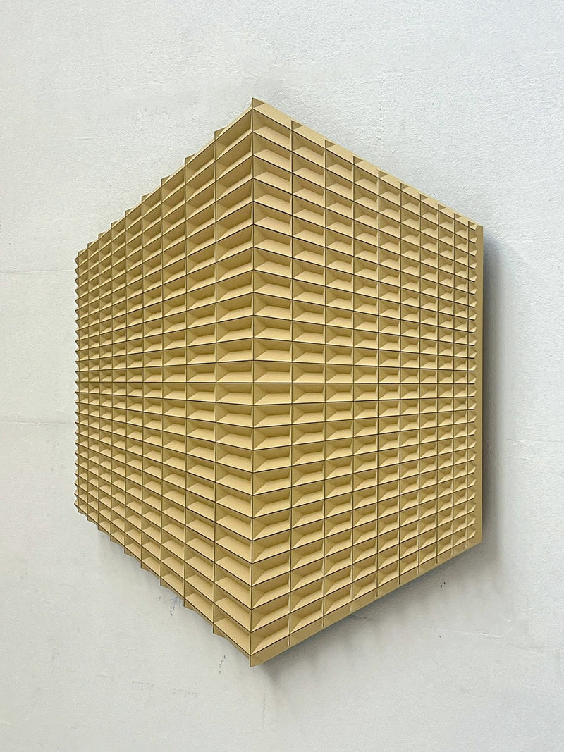 Hexagram Sculpture — close-up of textured yellow surface on wall