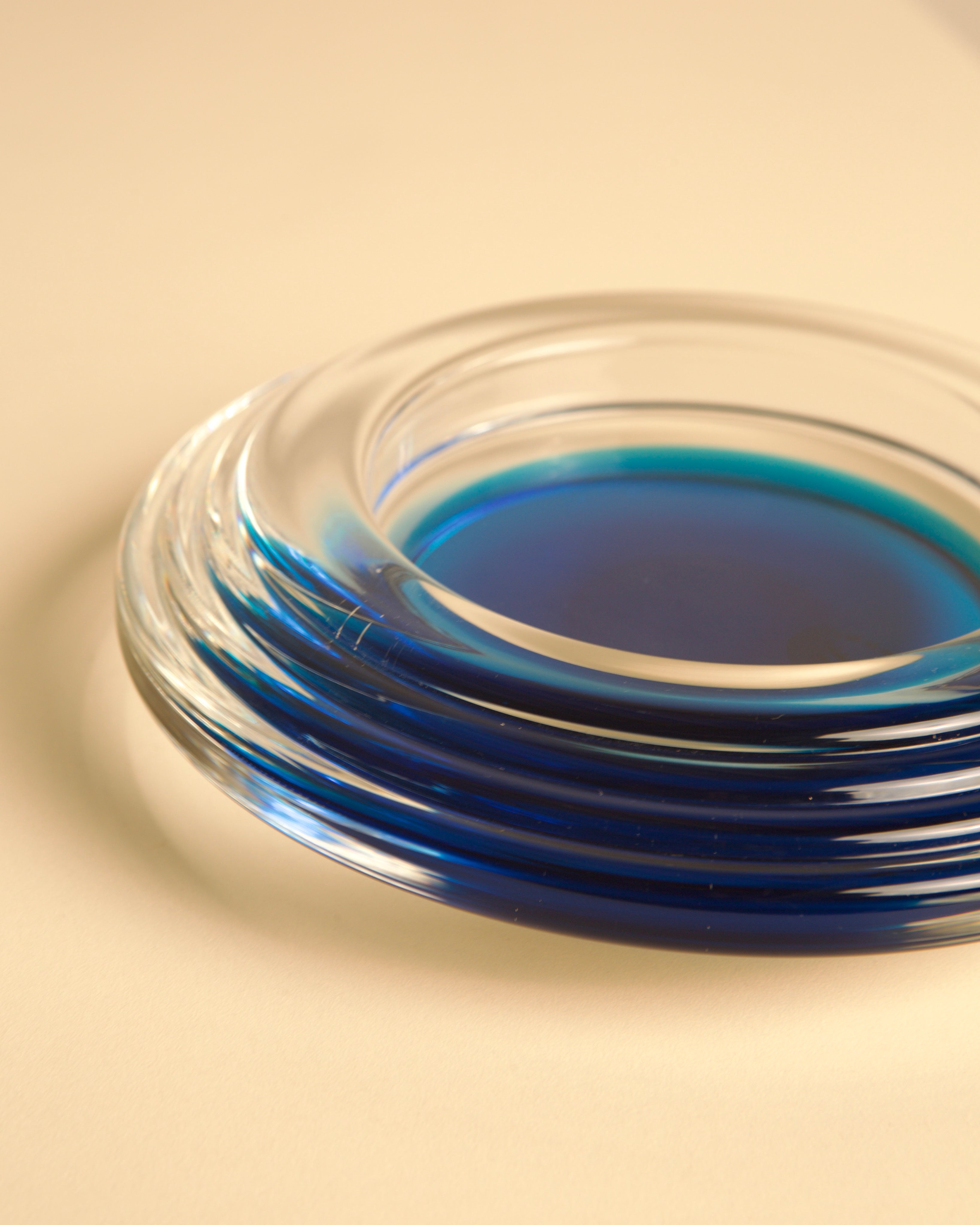 Curved blue Murano glass tray detail showing translucent layers