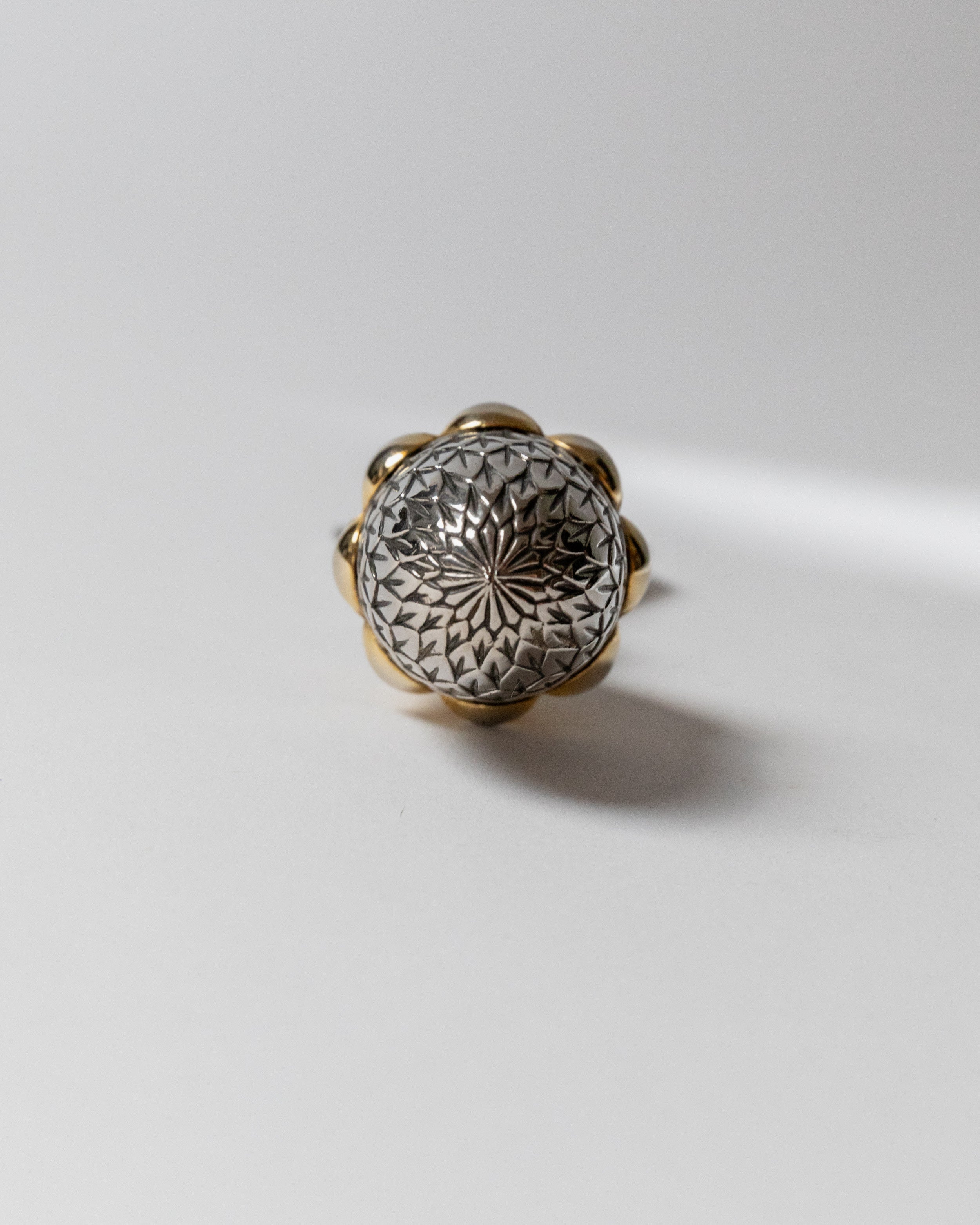 Silver plated bottle opener with ornate diamond-cut pattern detail