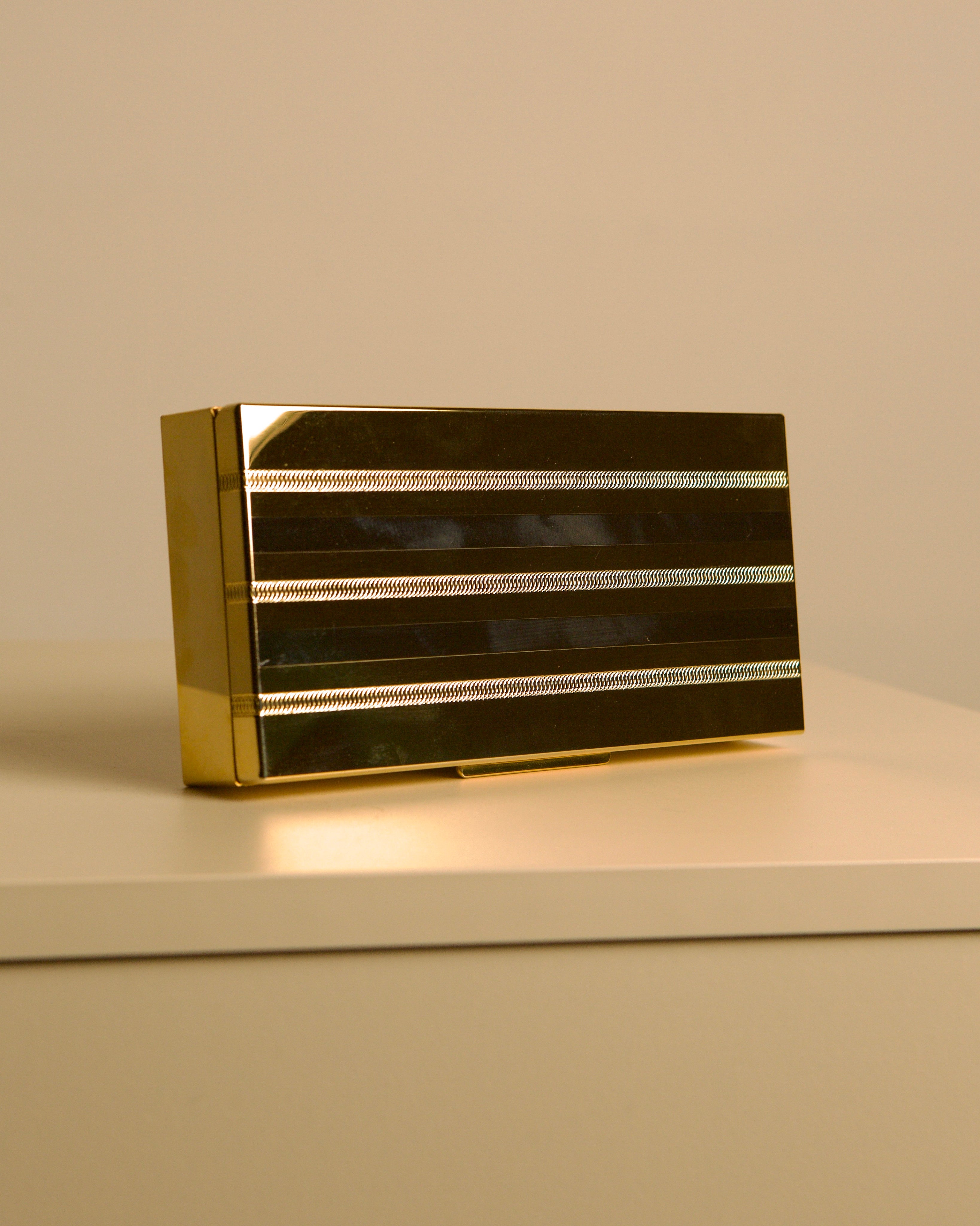 Italian Box in Gold and Silver Metal "Holywood Regency" 70s — side angle showing metallic stripes on surface