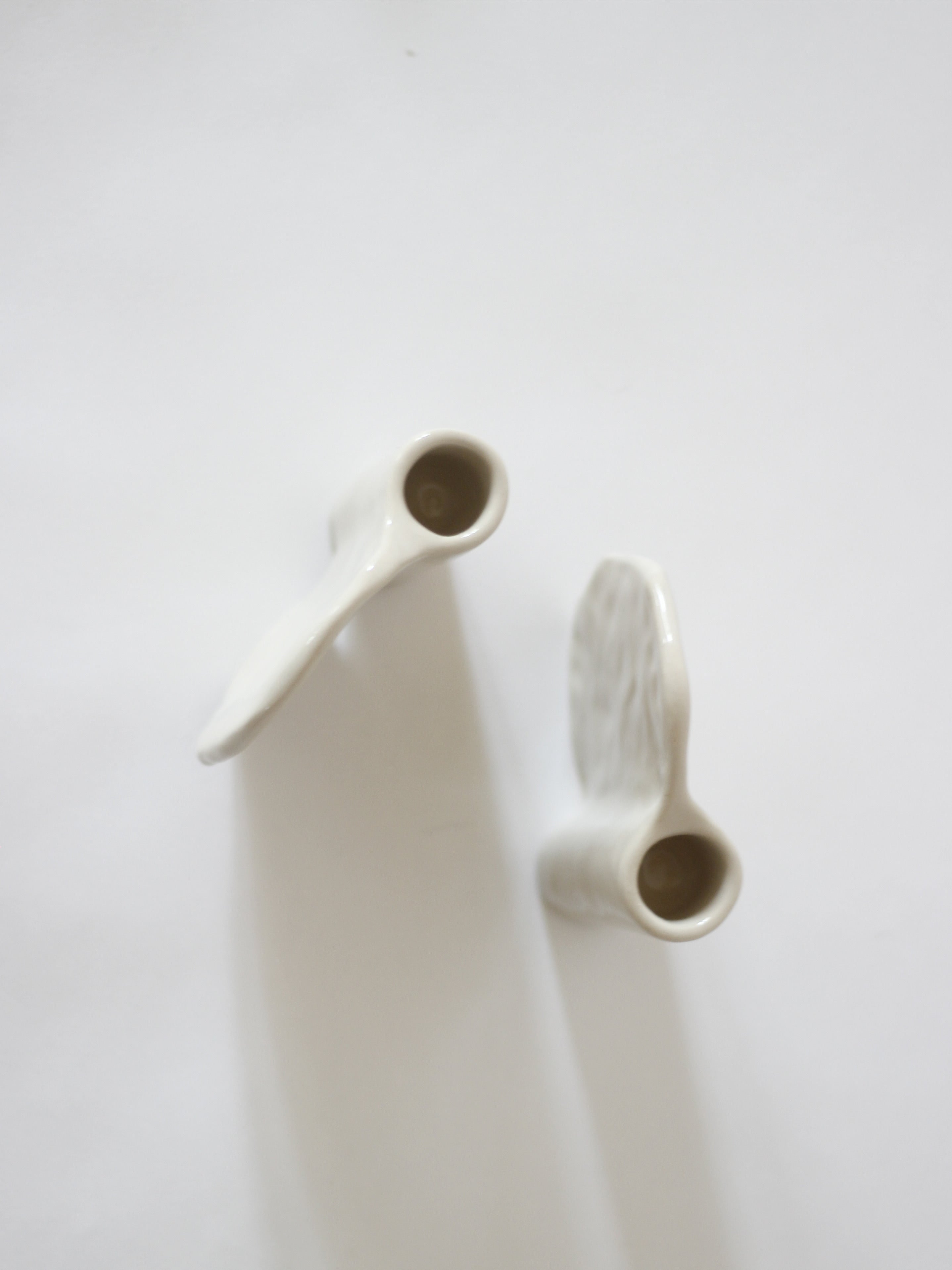 Candleholder in Stoneware with wing — back view highlighting smooth surface