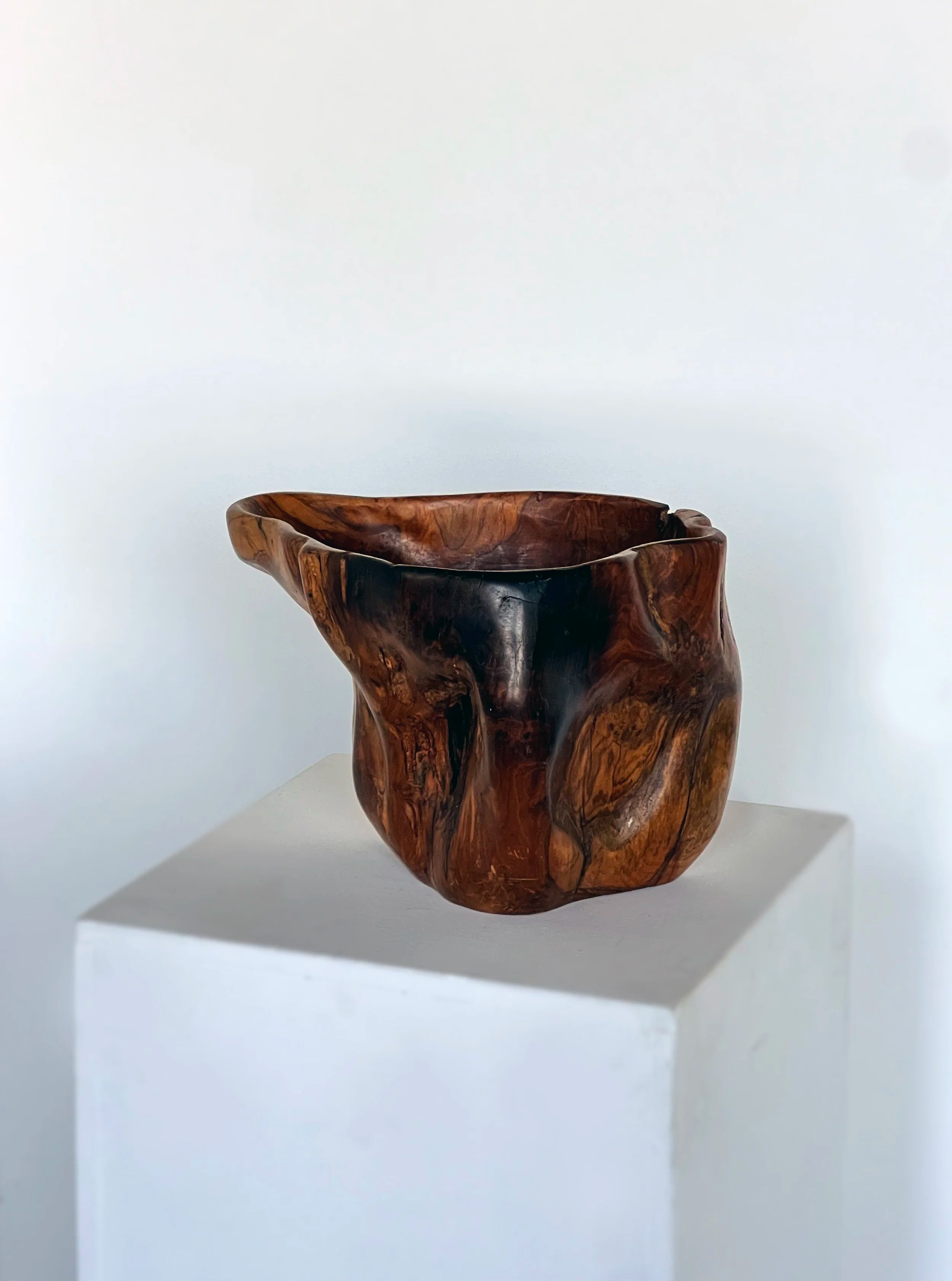 Carved organic form wooden bowl — close-up
