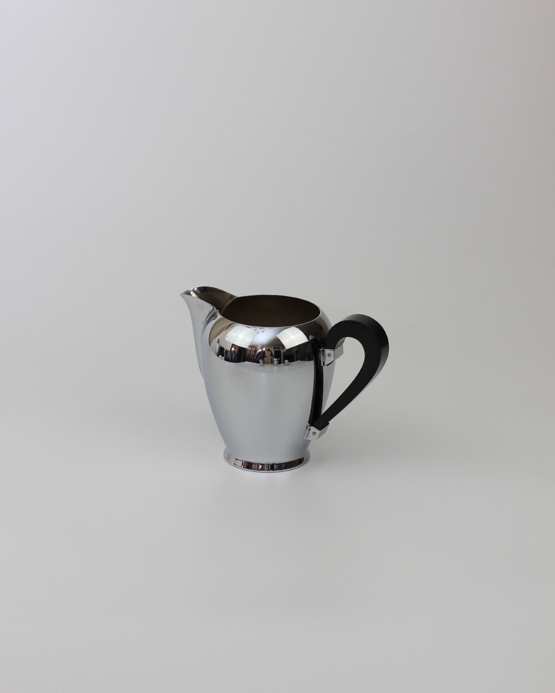 Italian Tea & Coffee Set — polished silver pitcher on white background