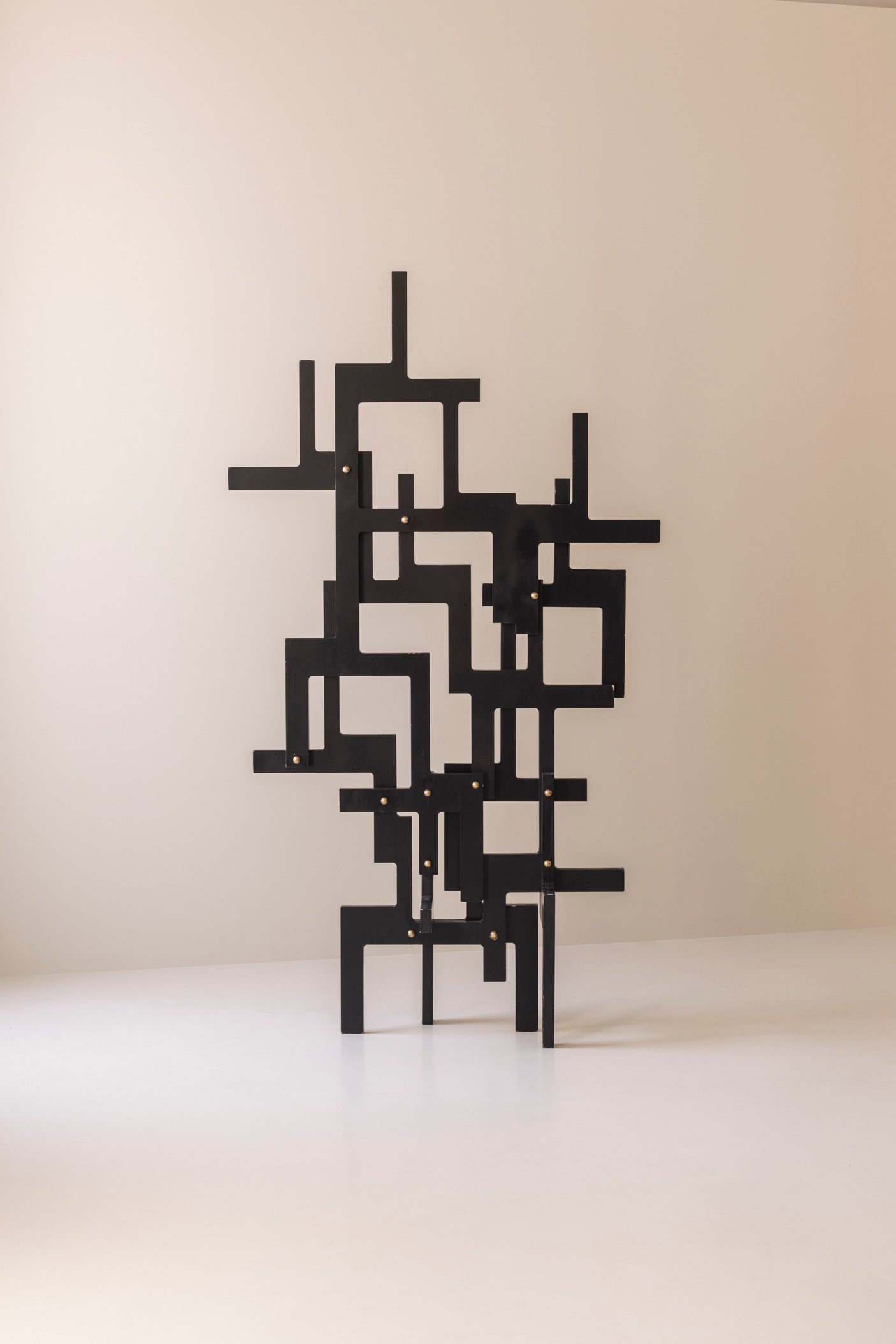 Large geometric abstract sculpture in lacquered wood and brass, France 1990s — detail view