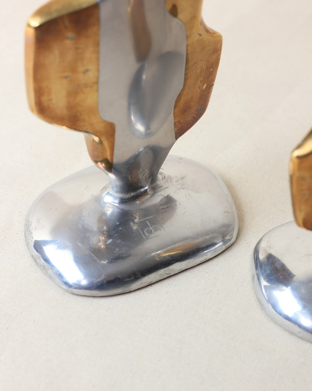 Brutalist Candleholders — side angle showing polished metal base