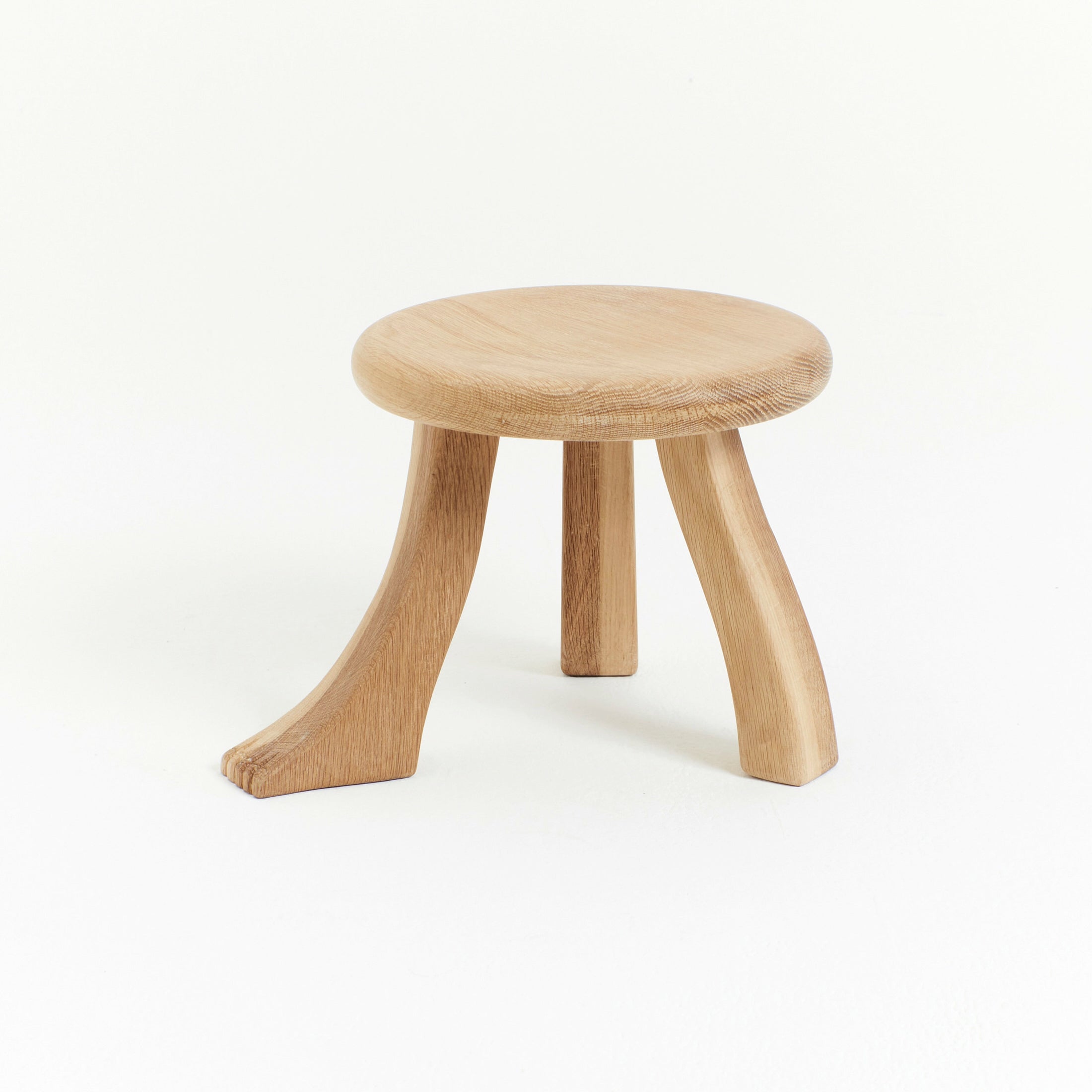 Foot Stool in Black Chestnut — back view showing wooden legs and round seat