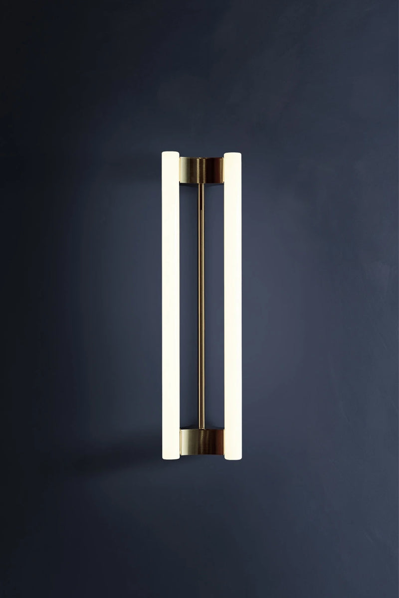 LIA WALL SCONCE 50 — close-up of modern brass and glass design