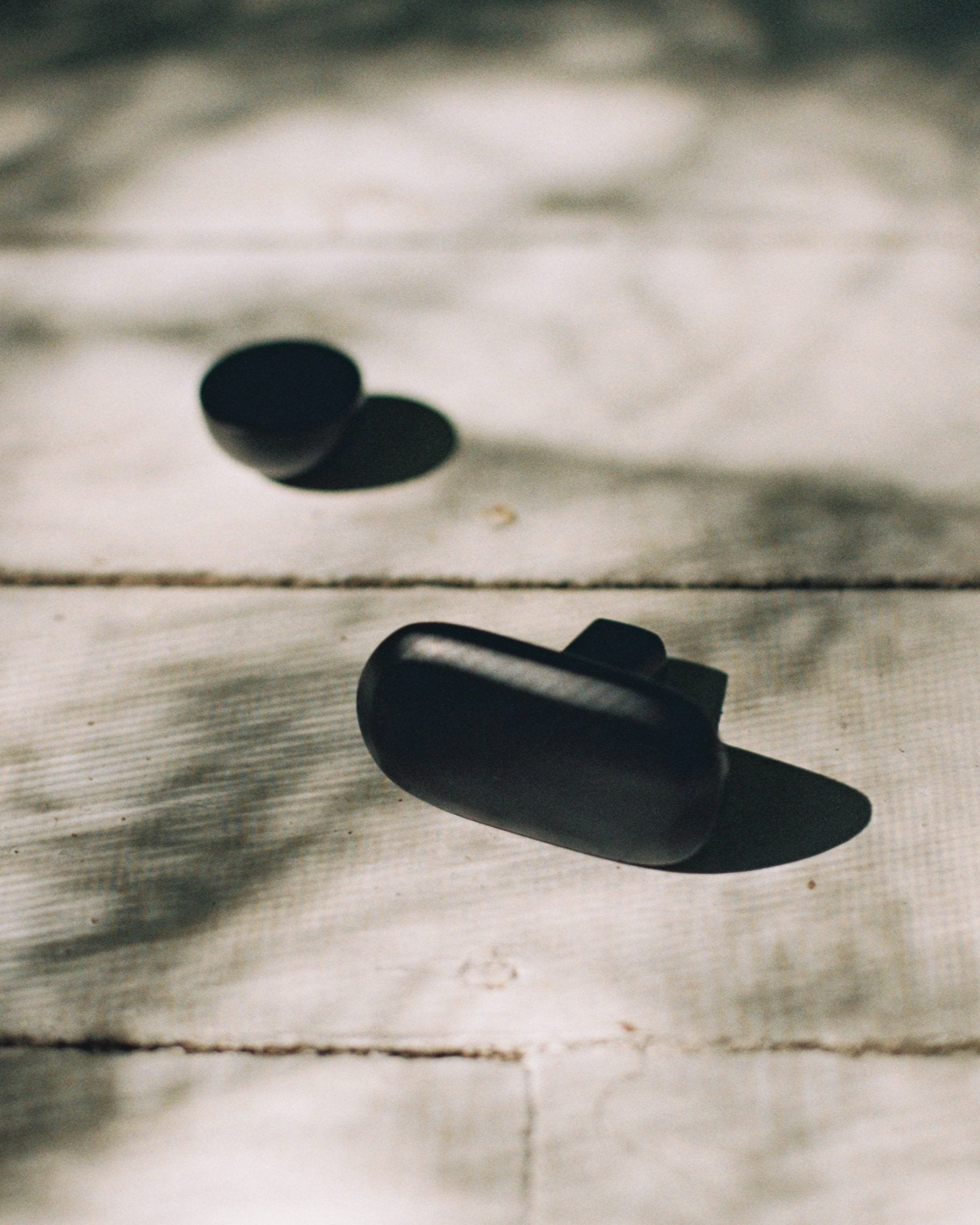 CERCLE Cabinet Knob Half — back view on wooden surface