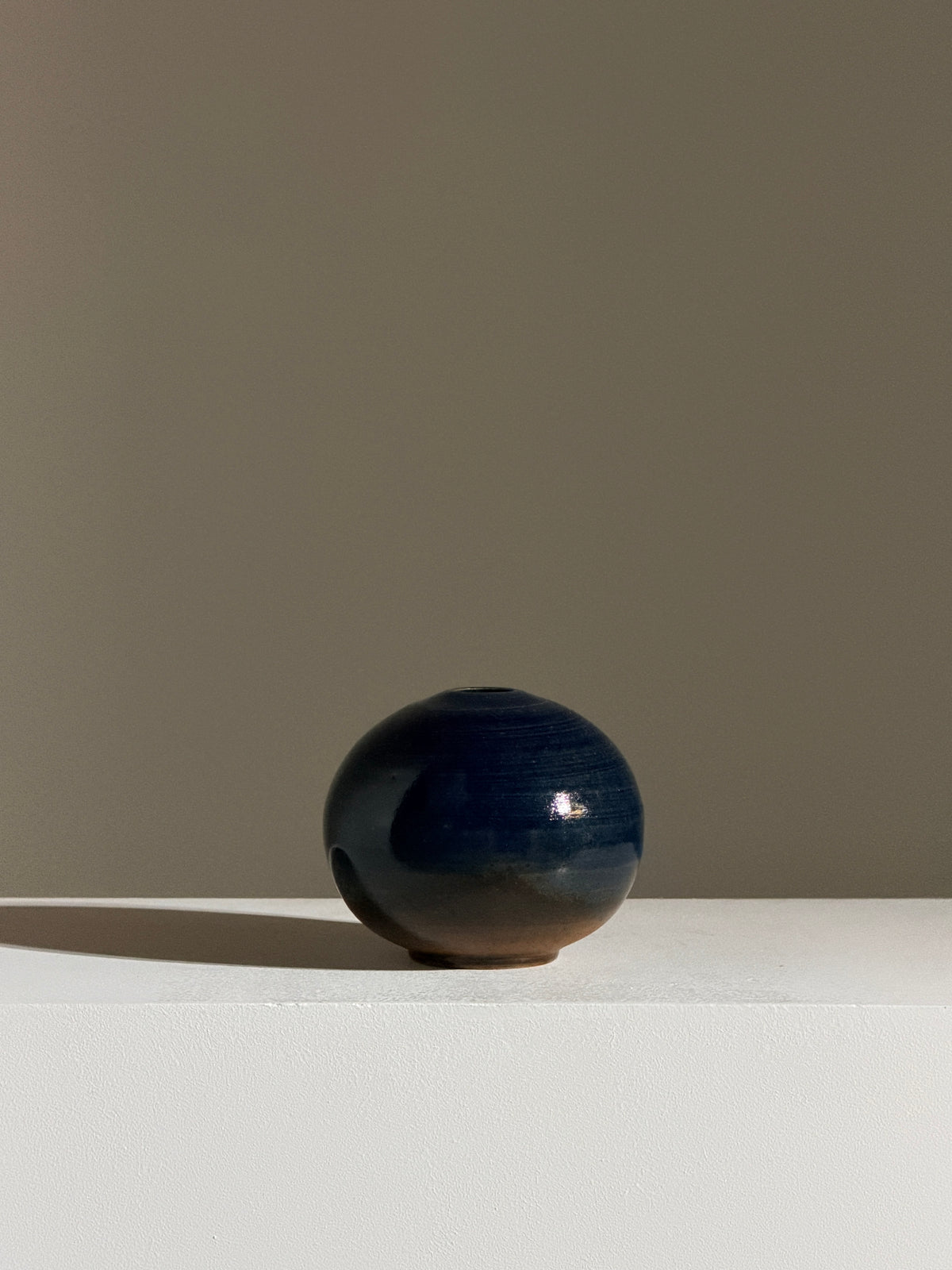 Small round stoneware soliflore vase, France, circa 1960.  — side angle