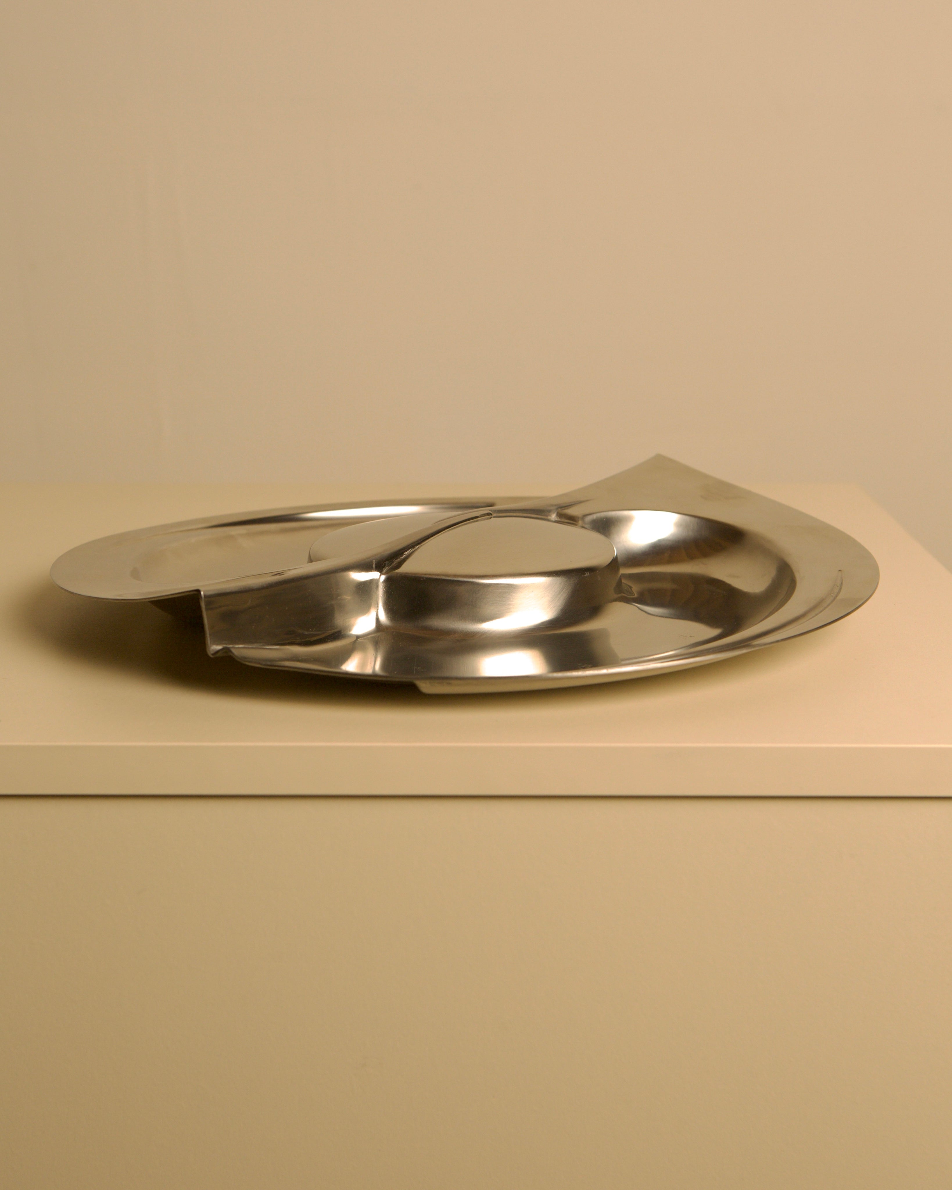 Large metal storage compartment 'Forma Orizzontale Circolare' by Carmelo Cappello for Ales — side angle showing polished stai