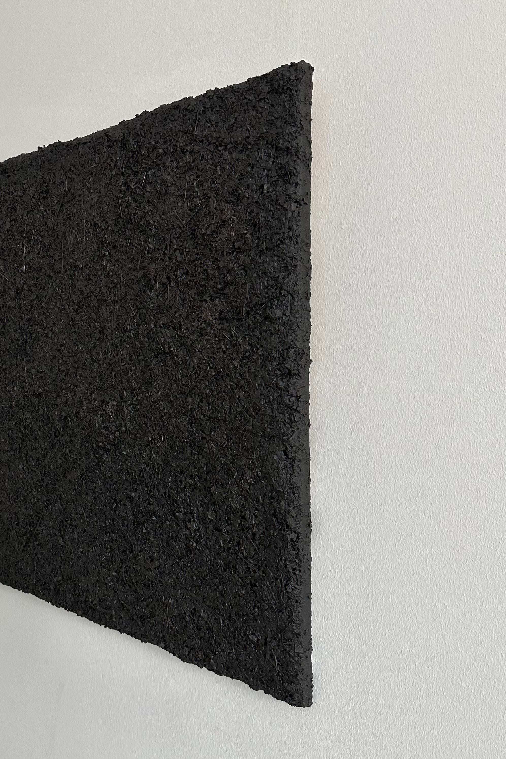 ARCHE 01' sculptural wall art — side view highlighting textured black surface