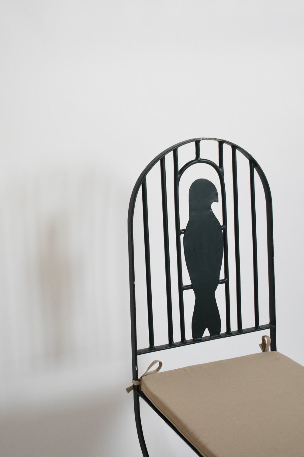 Pair of wrought iron bird cage chairs, 1960s. — side angle