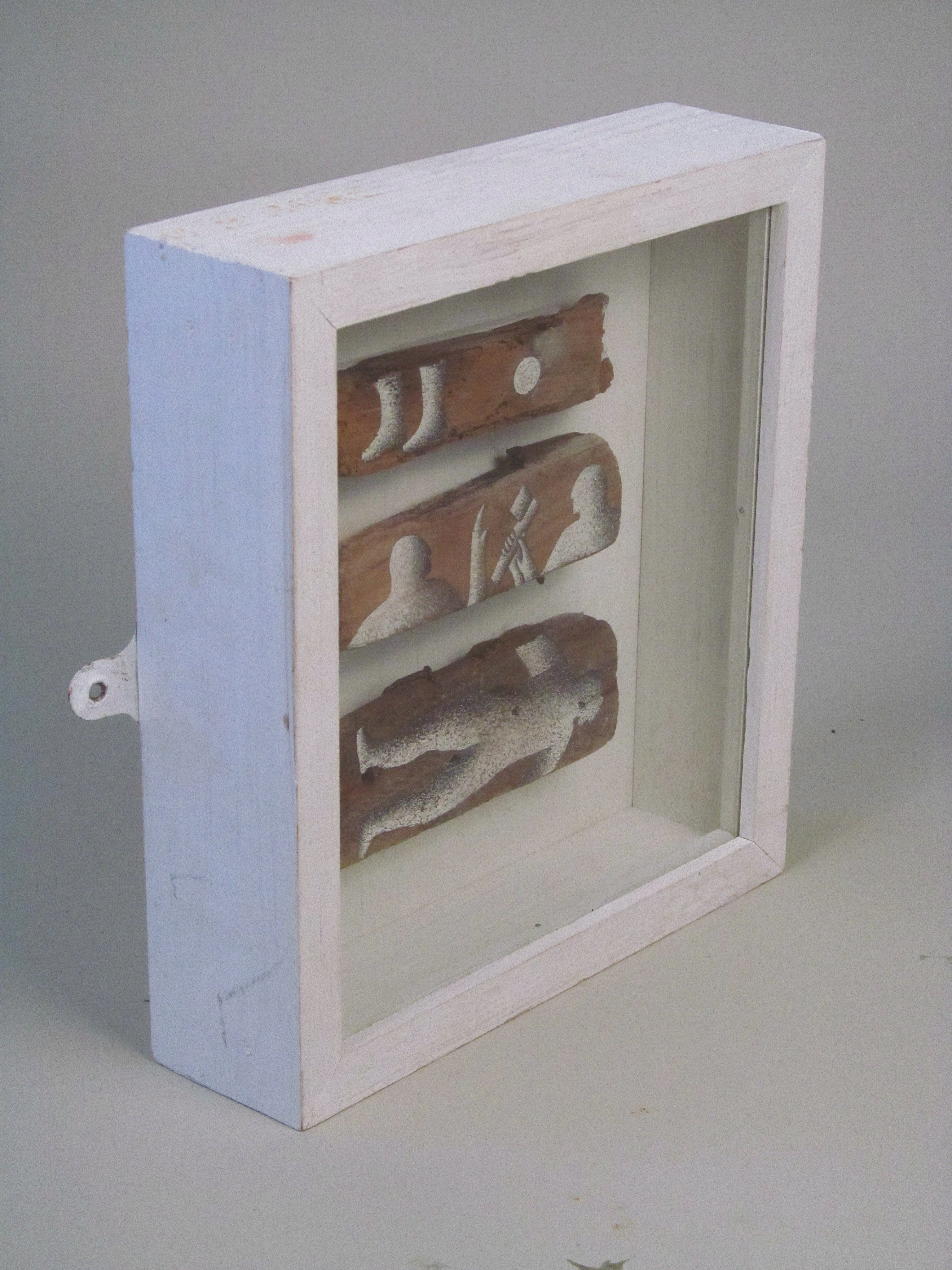St Magnus Tales No. 17, 1992 - Matilda Tumim — side view of wooden sculpture in white frame