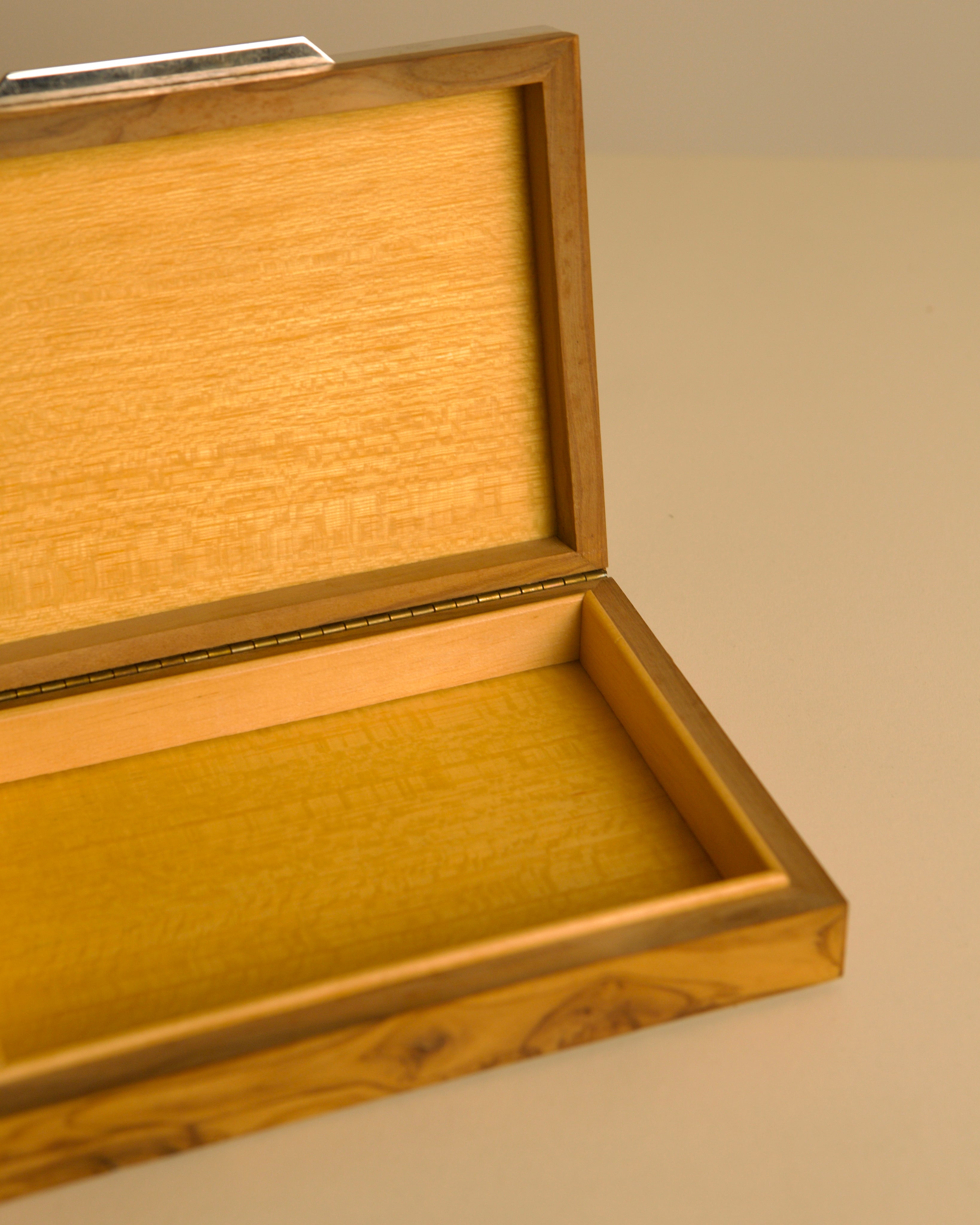 Italian box in metal, brass and solid olive wood, 1970s — top view showing interior with light wood finish