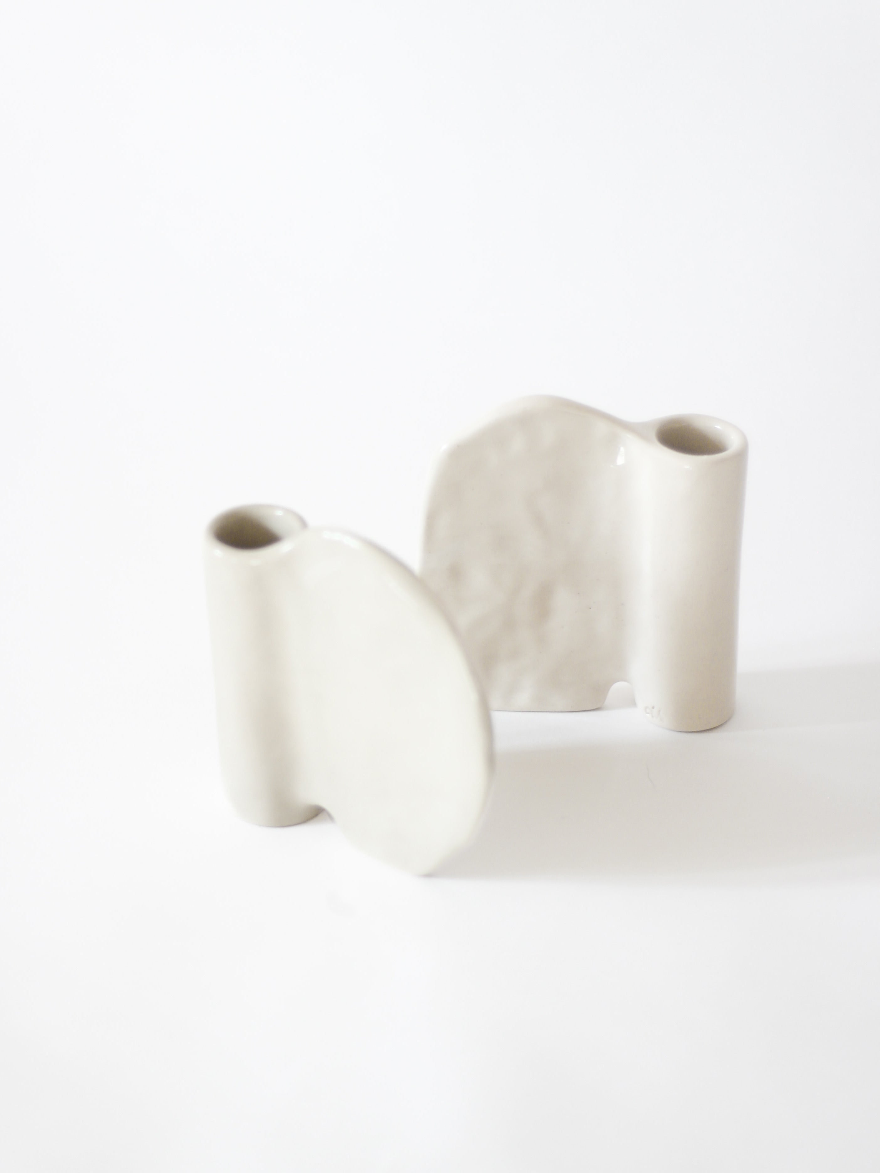 Candleholder in Stoneware with wing — side angle showing smooth gray surface
