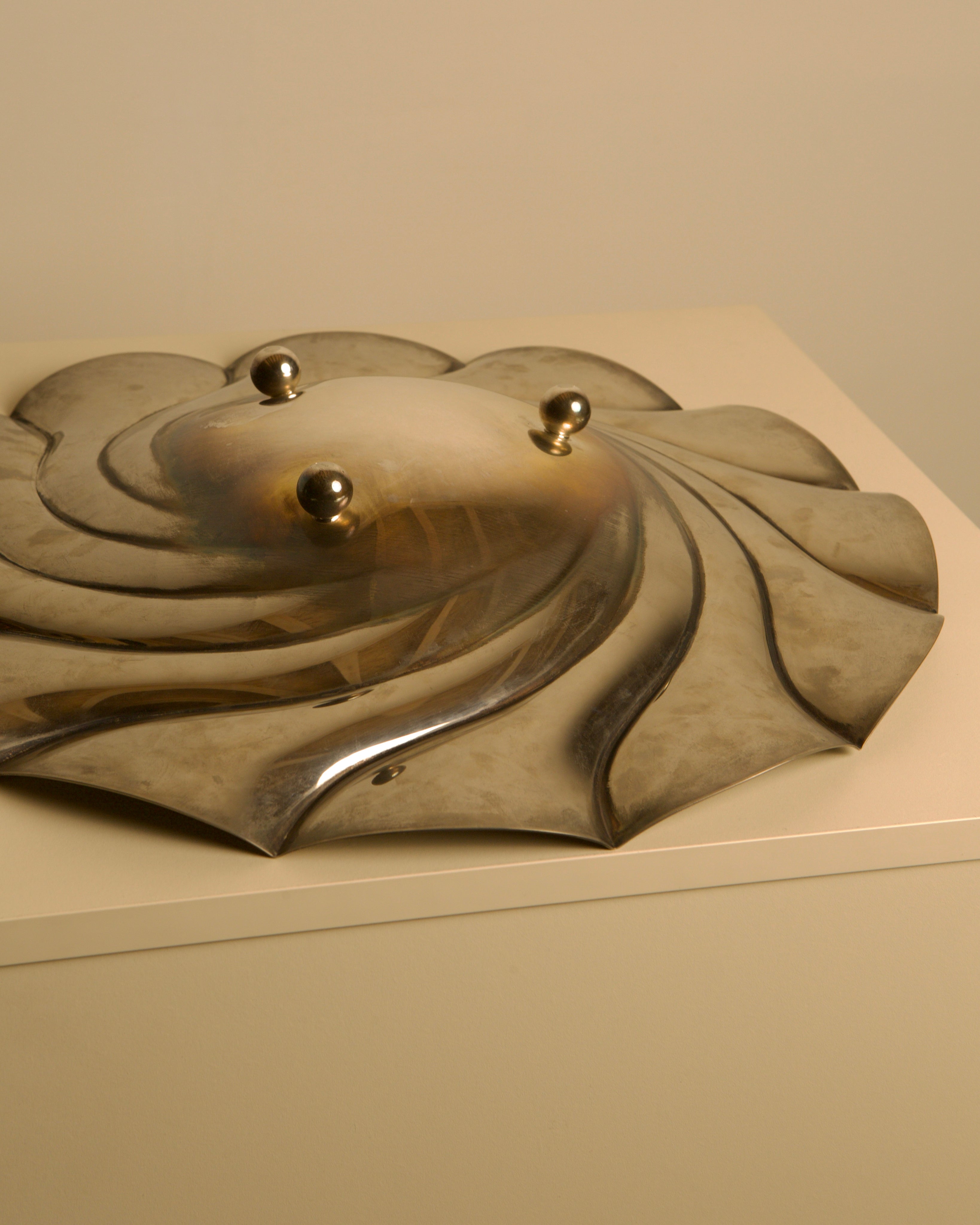 Large Italian Silver-plated Metal Vide-poches — angled view on neutral surface