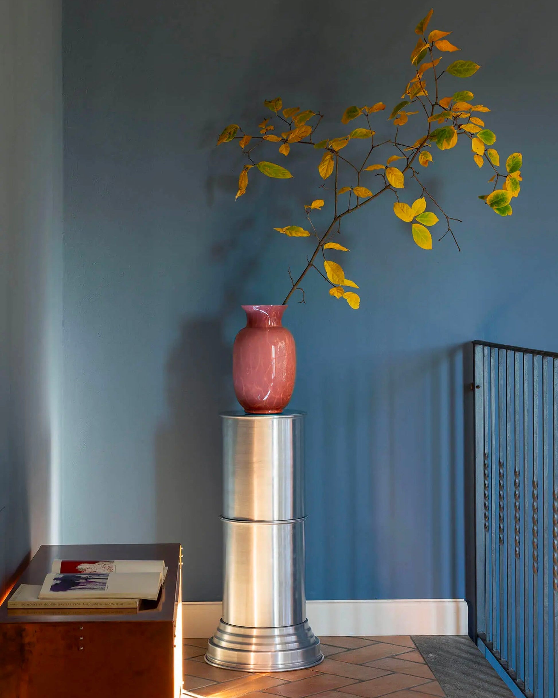 Contemporary End Tables in Metal - Brushed Collection — close-up of brushed metal surface with decorative vase