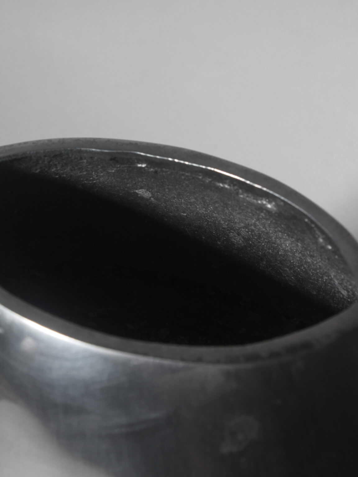 Polished Aluminum Flat Rounded Vase — side angle