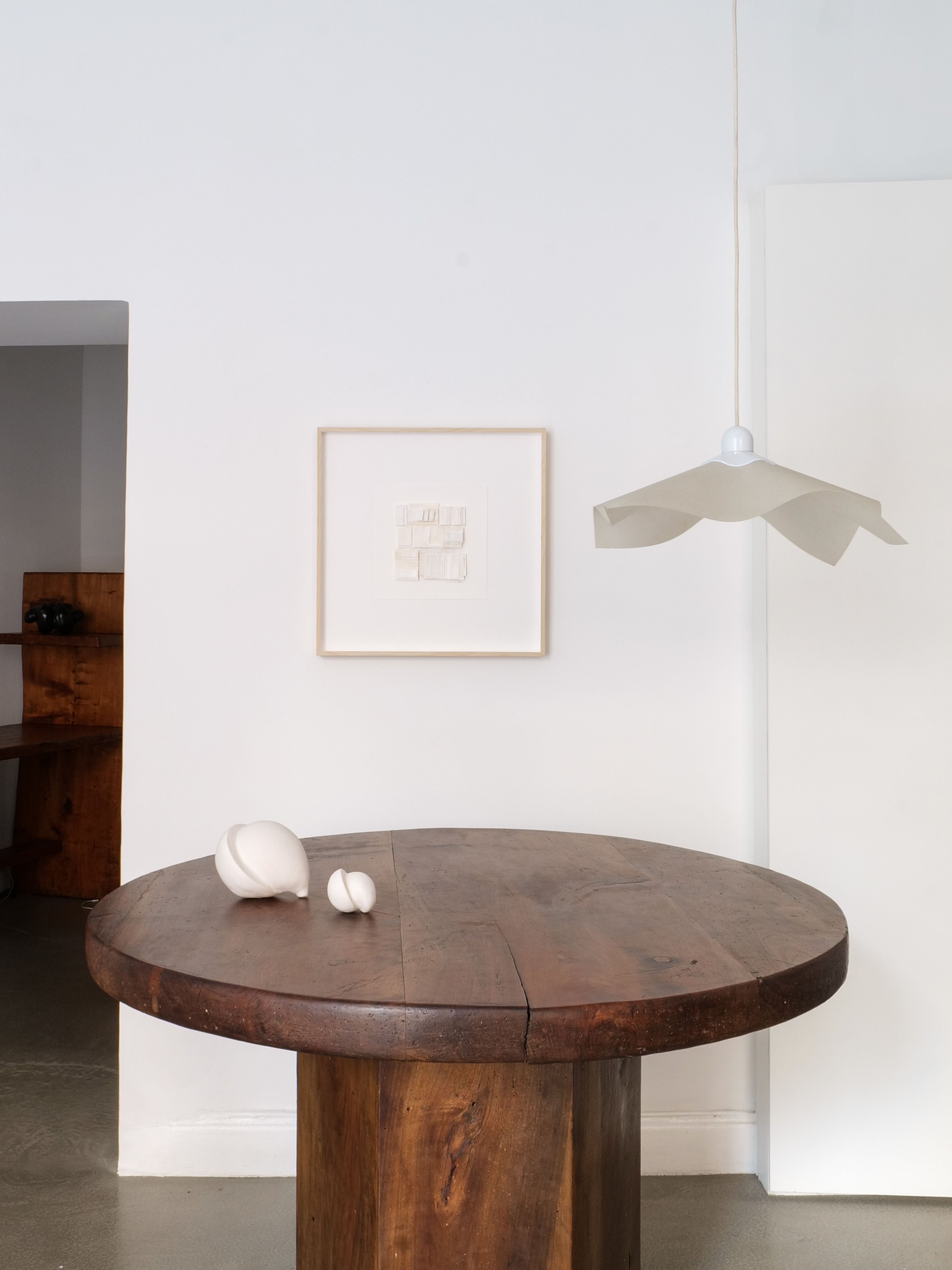 Adjustable Ceiling Lamp Mario Bellini 1970 — side angle above wooden table