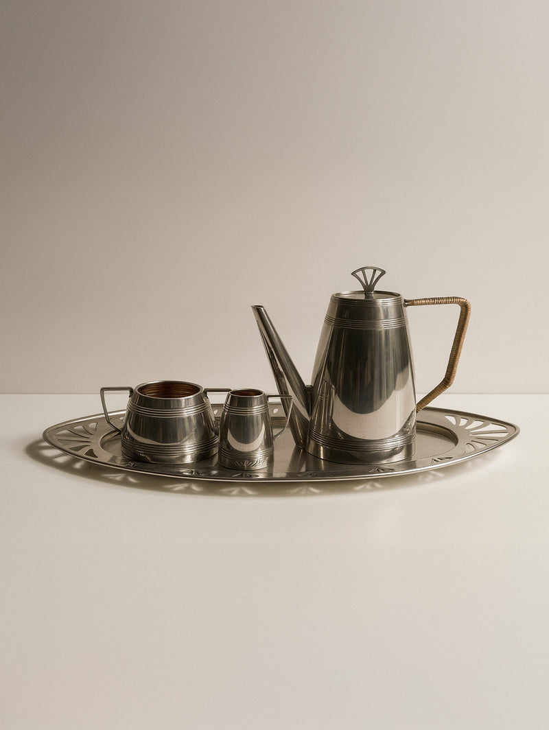 Art Deco silver coffee set with teapot and cups on tray