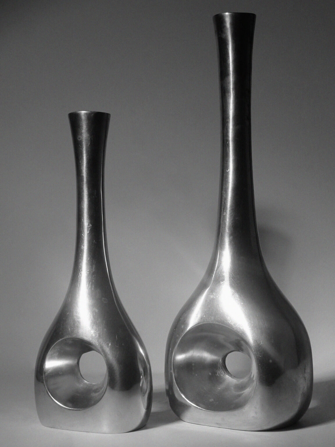 Polished Aluminum Circular Cutout Tall Vases Set — detail view