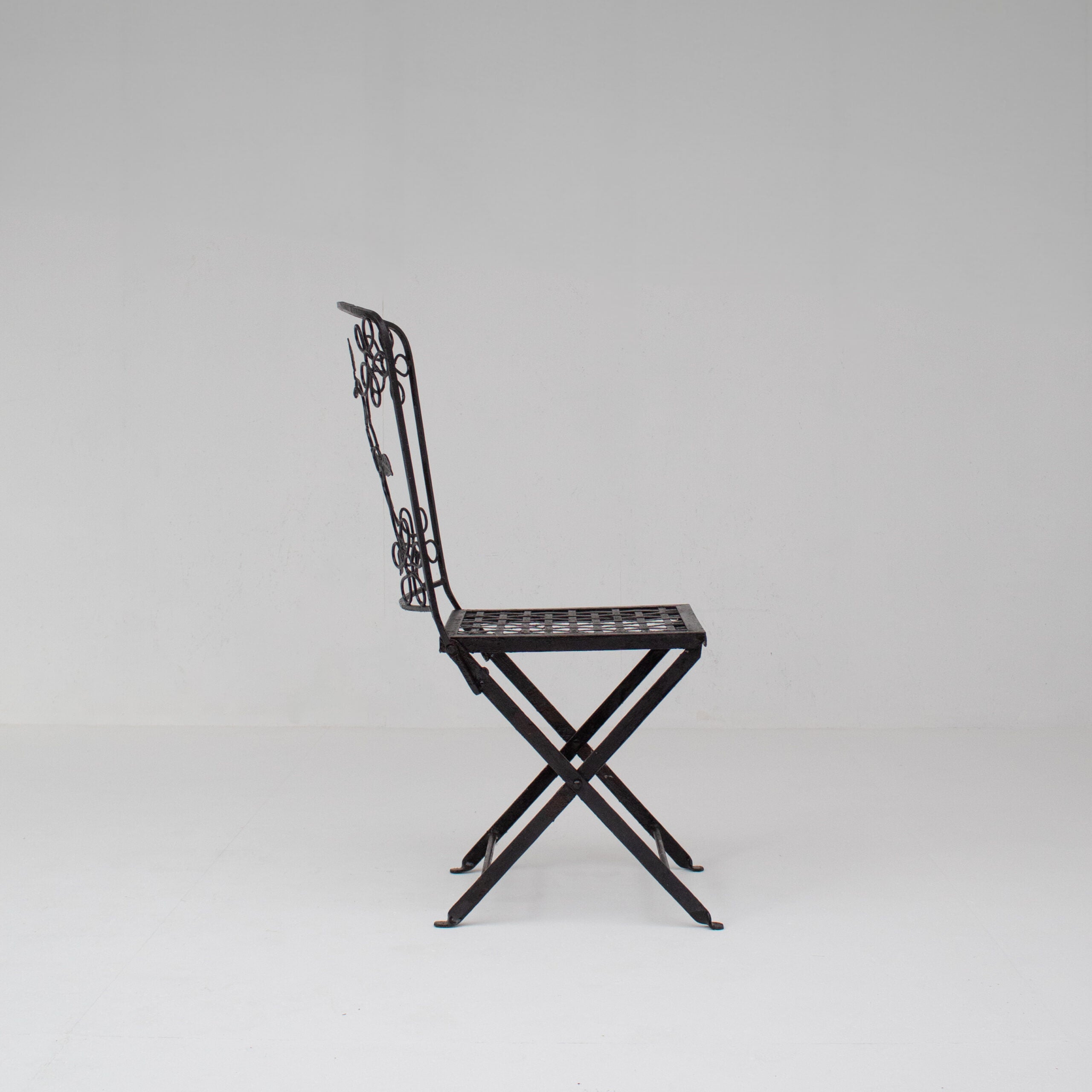 Set of Three Decorative Wrought Iron Garden Chairs with Floral Backrests — close-up