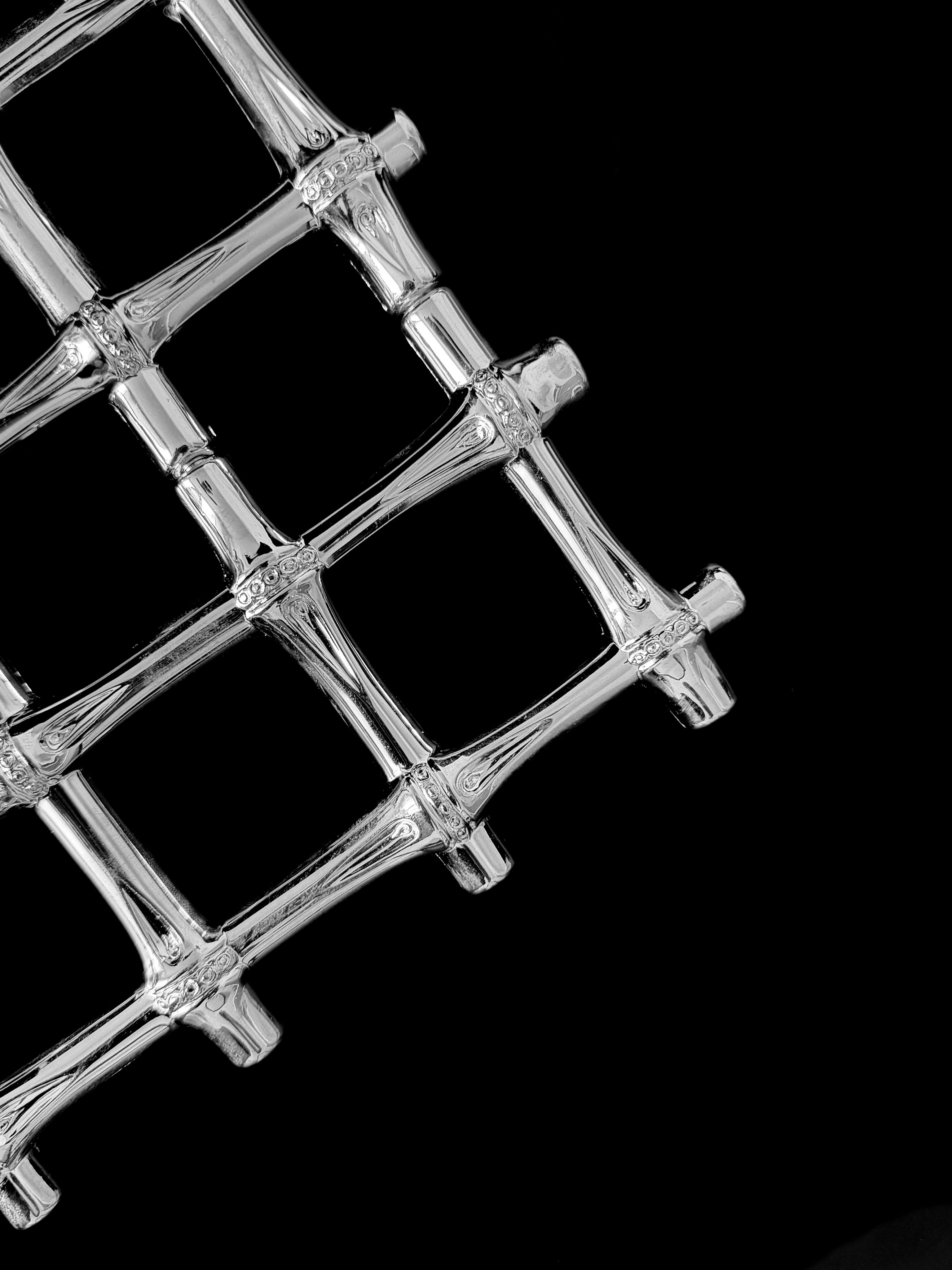 A vintage silver plated trivet — side angle