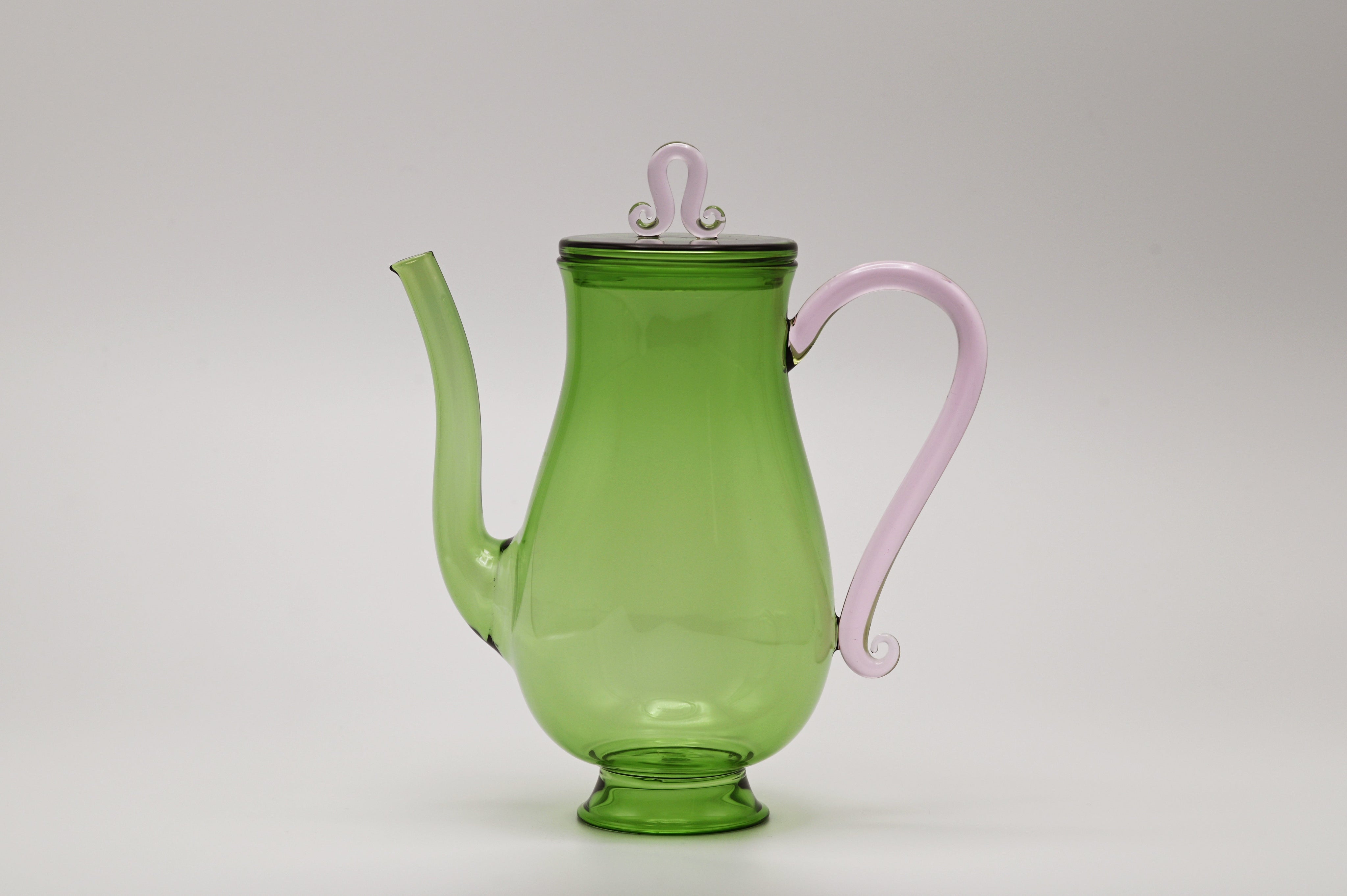 Bell Pot — side view of green glass with pink handle