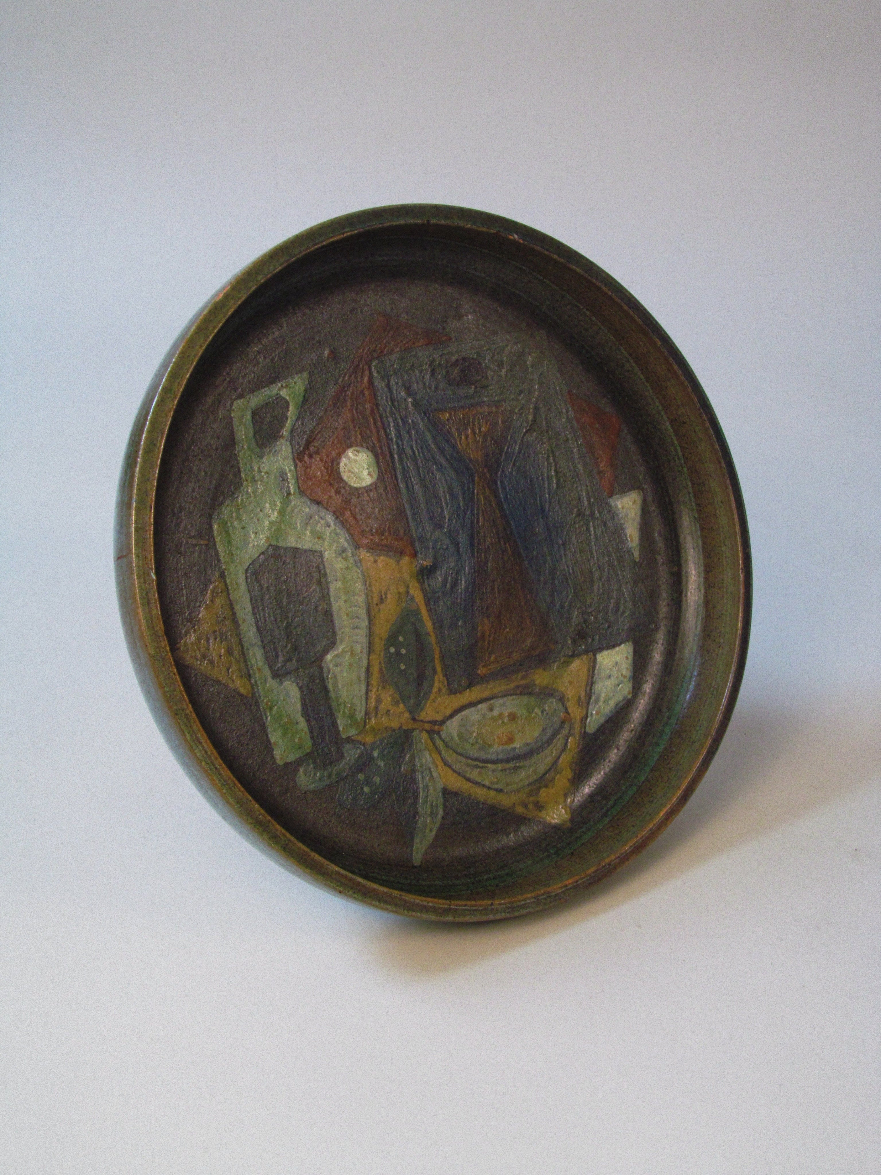 Cubist Charger c.1960 — side angle showing painted ceramic design