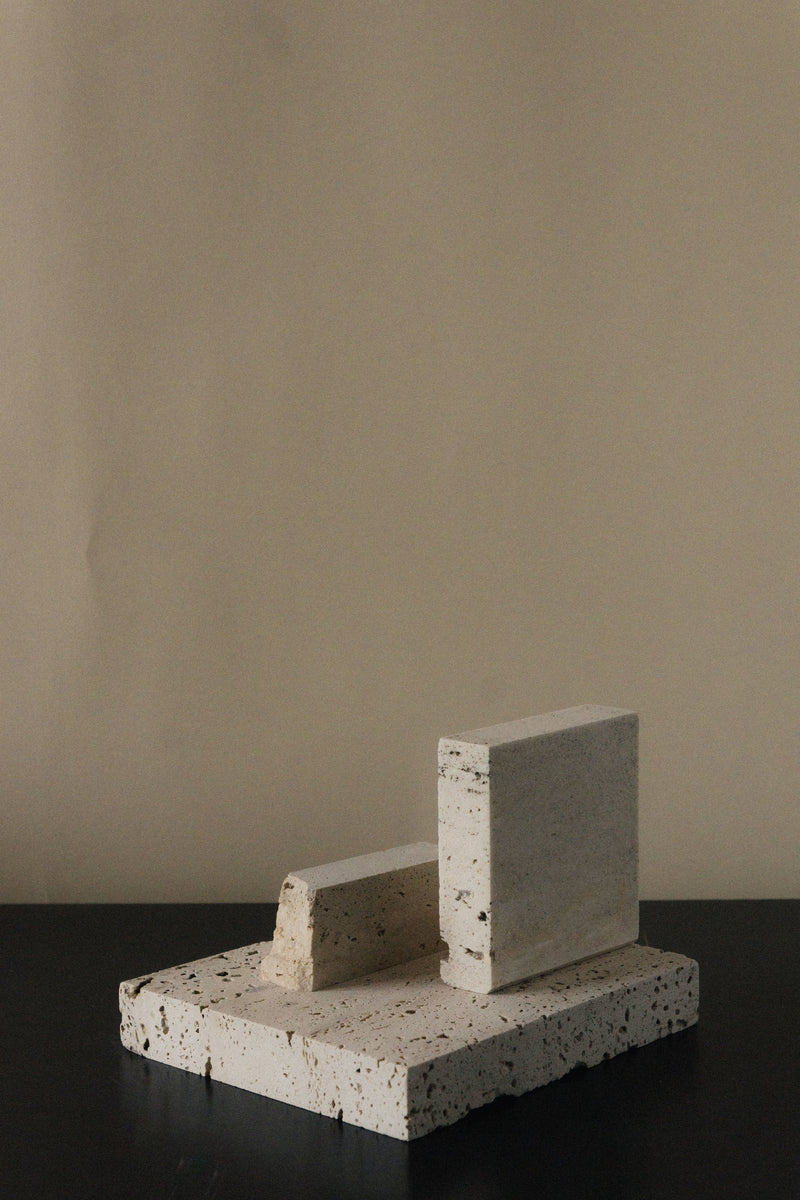 Monument II - Handmade Travertine Marble Bookstand — close-up of textured stone surface