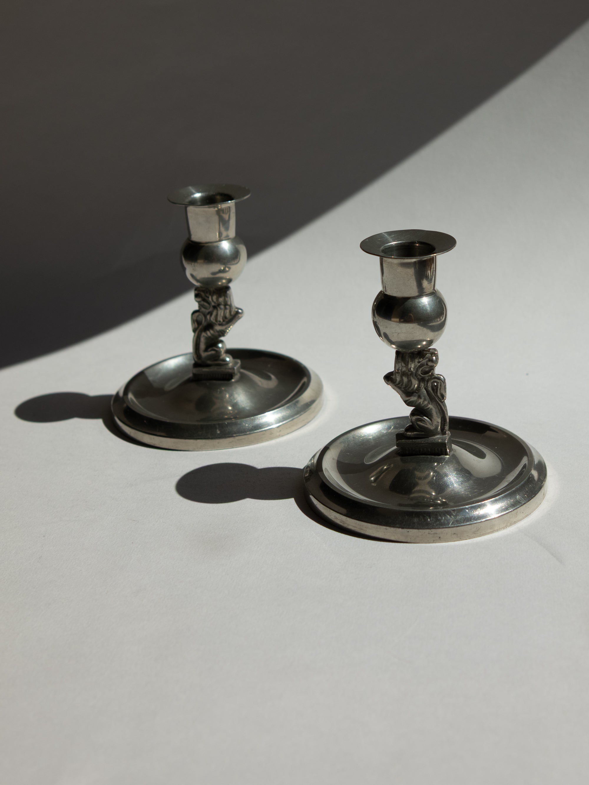 Pair of Swedish Grace Art Deco Pewter Lion Candlesticks by Eskilstuna Metallindustri, 1932 — close-up