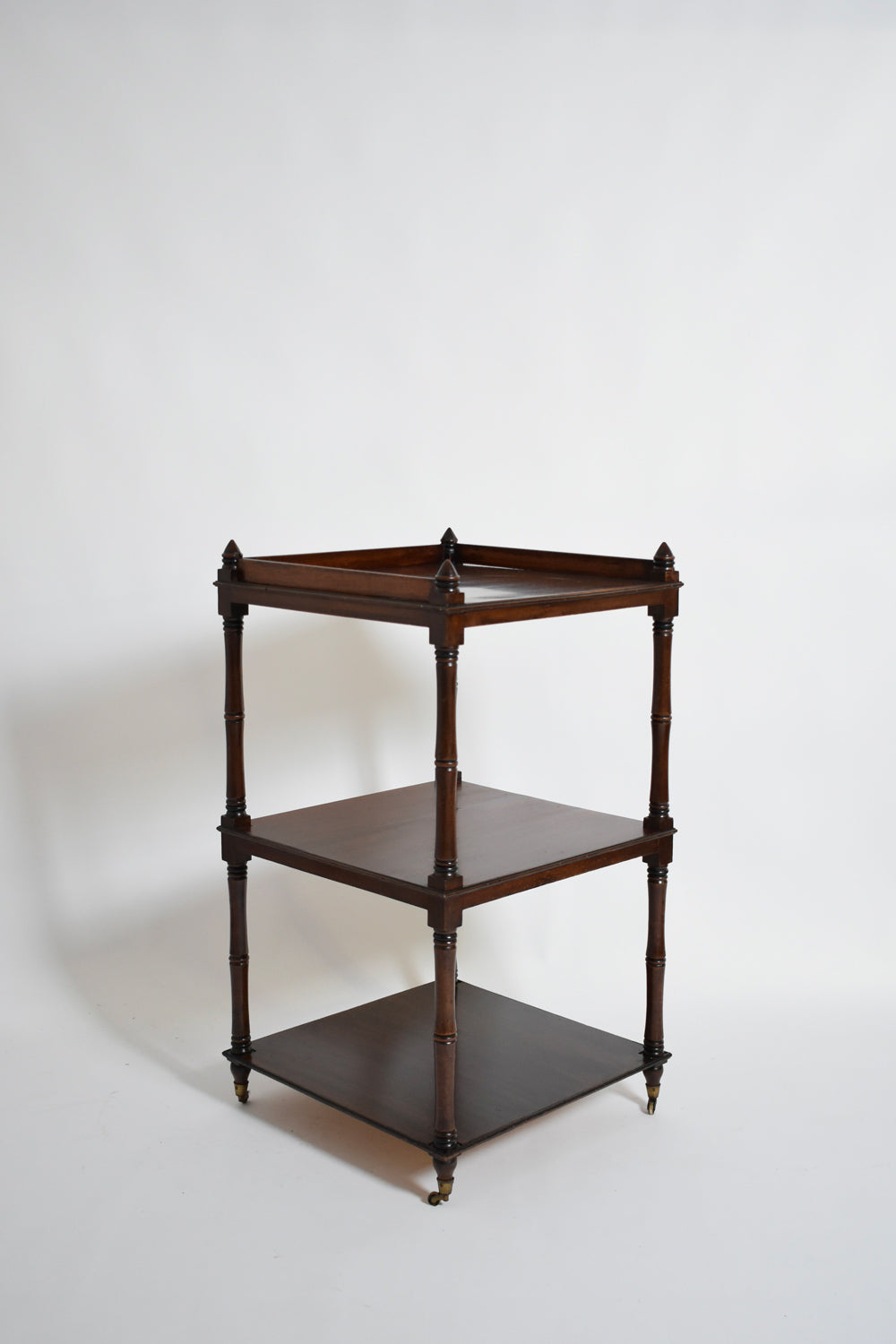 Faux Bamboo Bookshelves Pedestal Table, 1960s — side angle showing dark wood finish