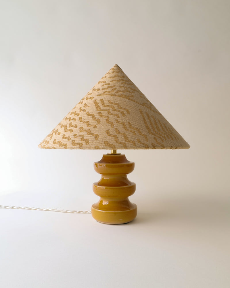Sculptural ceramic table lamp with triangular woven shade