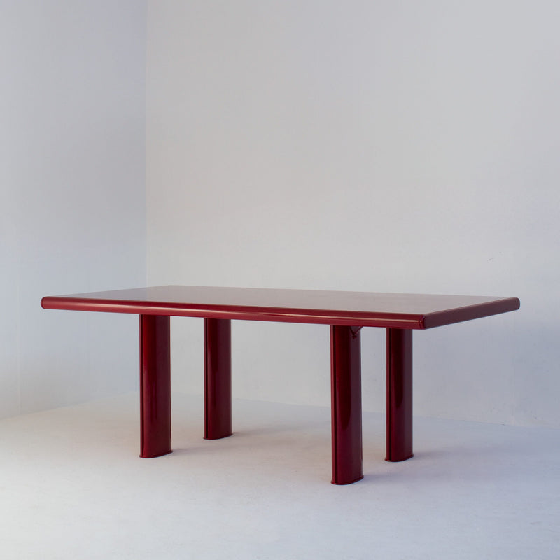 Red Lacquered Dining Table in Wood and Metal — angled view highlighting glossy red finish
