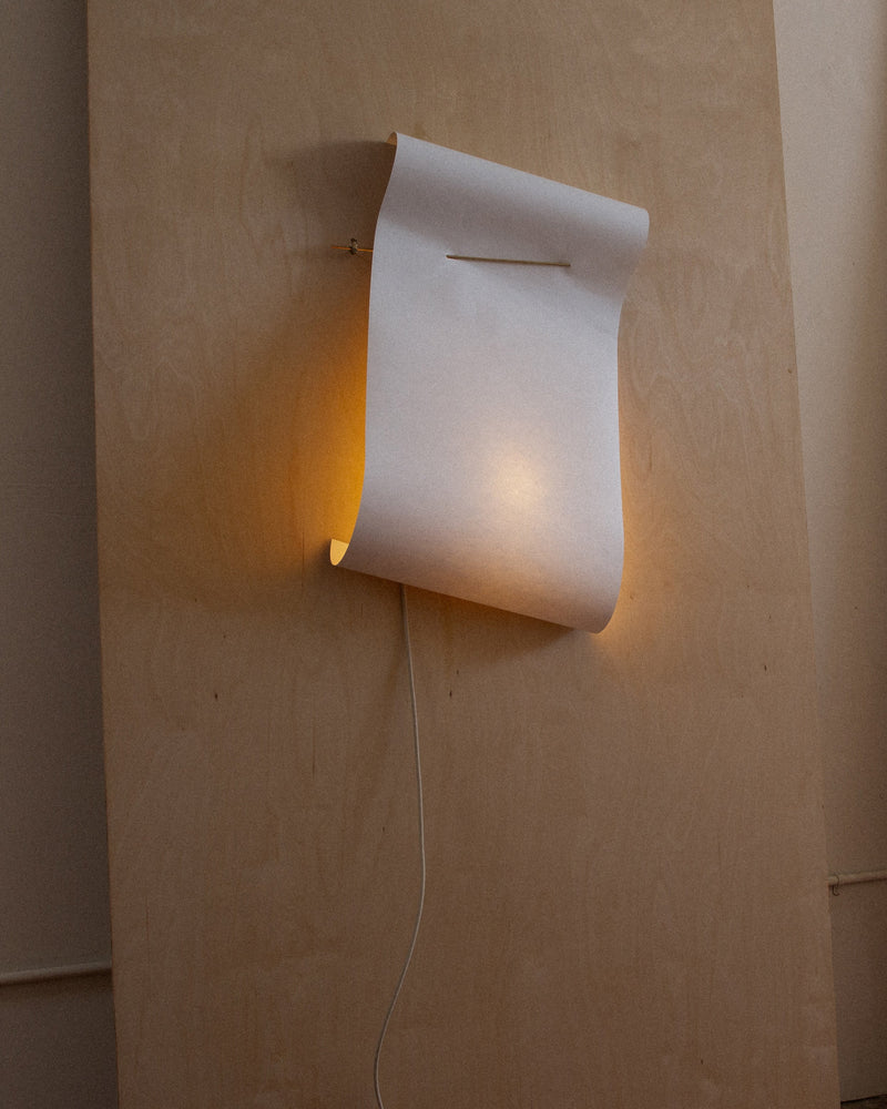 Wall Light - Papēr II — close-up of white paper shade with warm glow