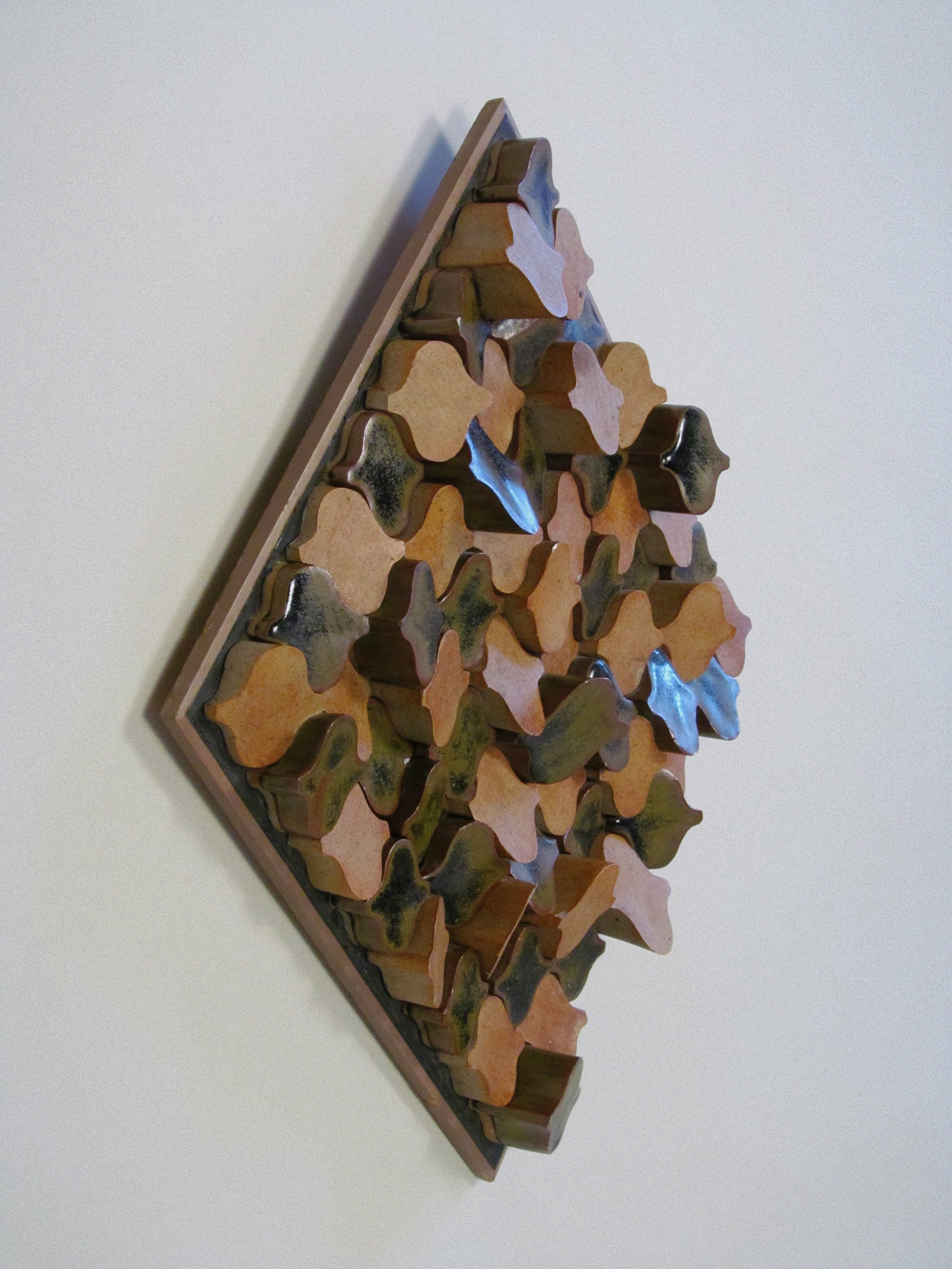 Derbyshire School of Art Ceramic Wall Plaque with Original Case c.1970 — angled view highlighting textured ceramic surface
