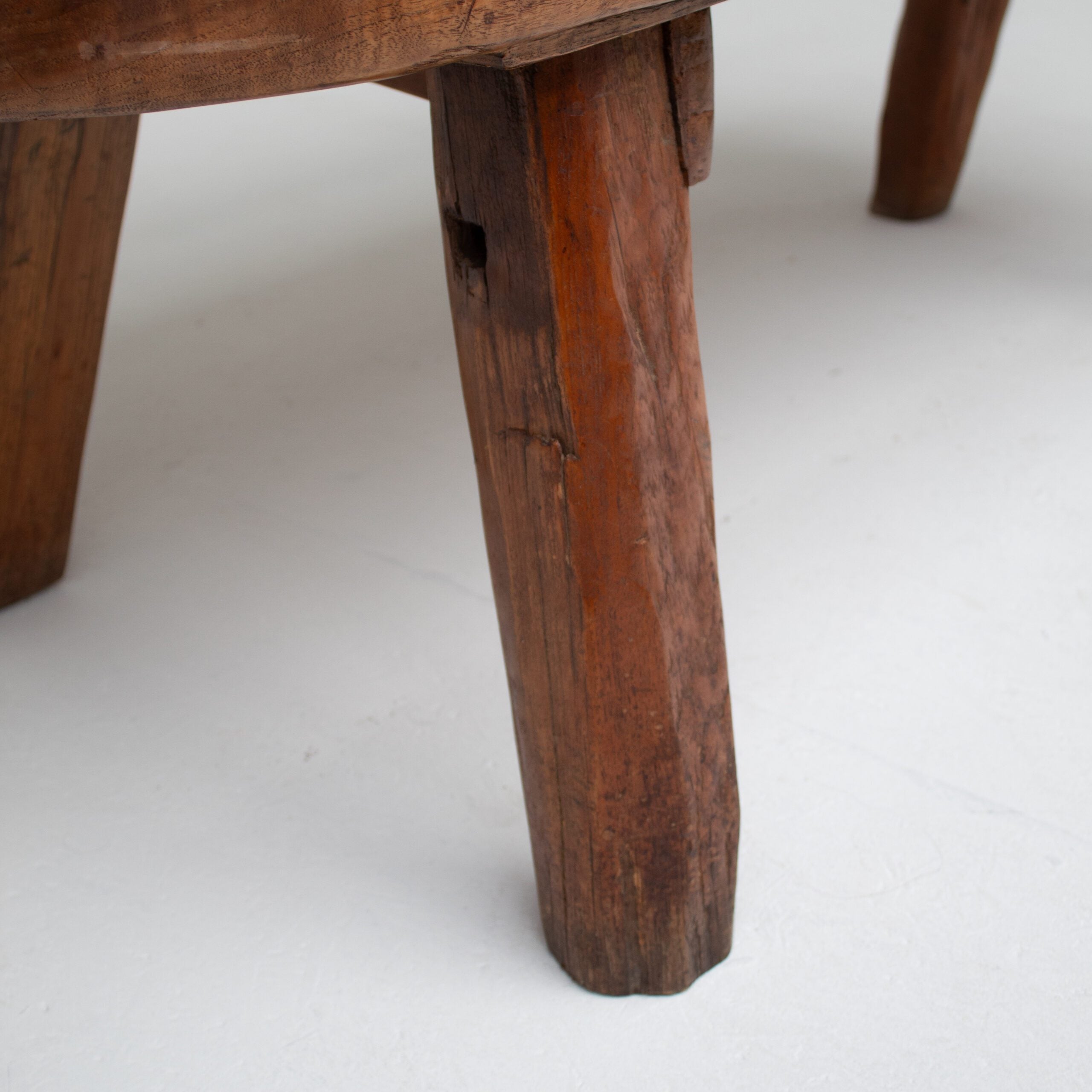 Rustic Wooden Bench — close-up of weathered wooden leg detail