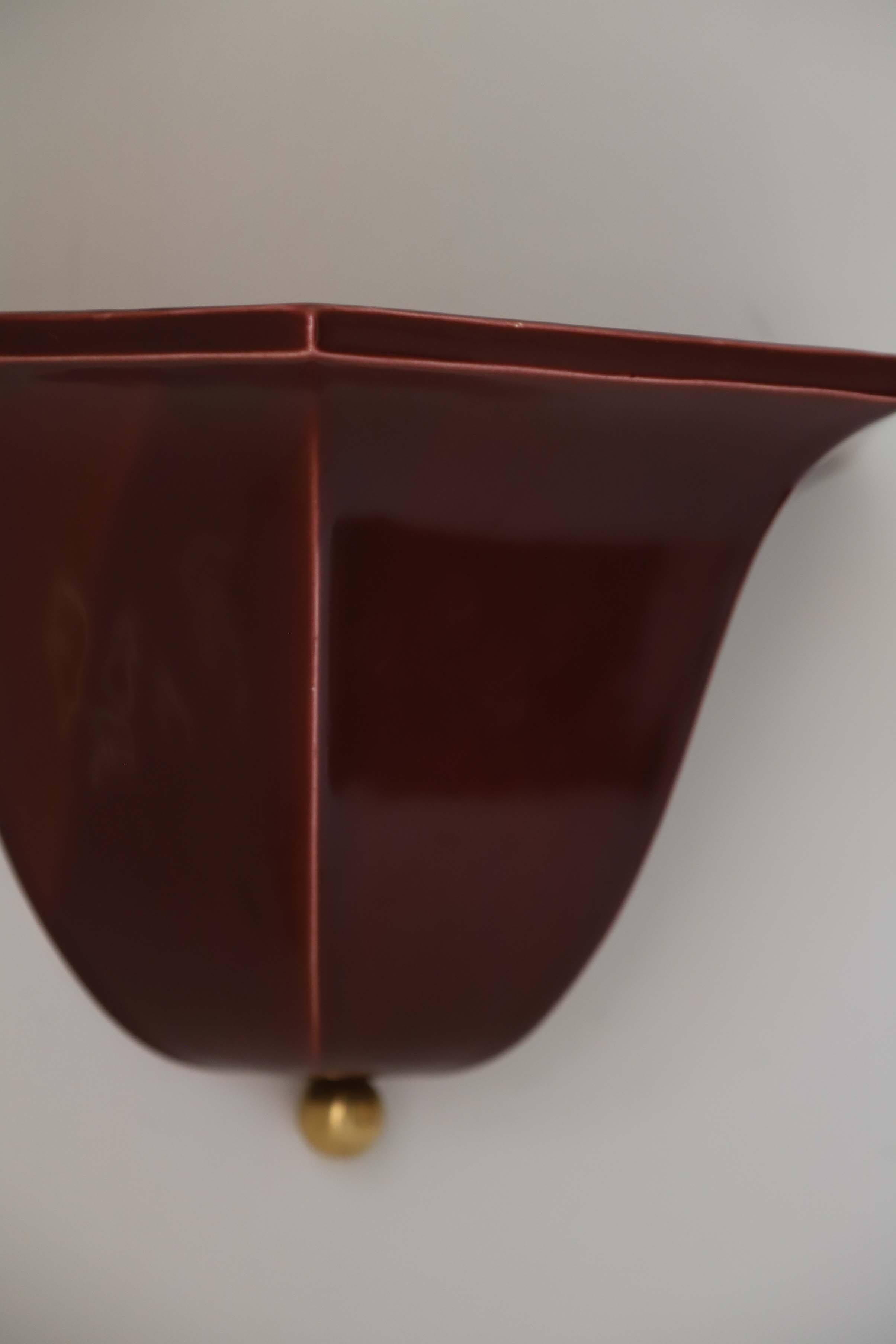 Burgundy ceramic Maeve wall sconce detail with brass accent
