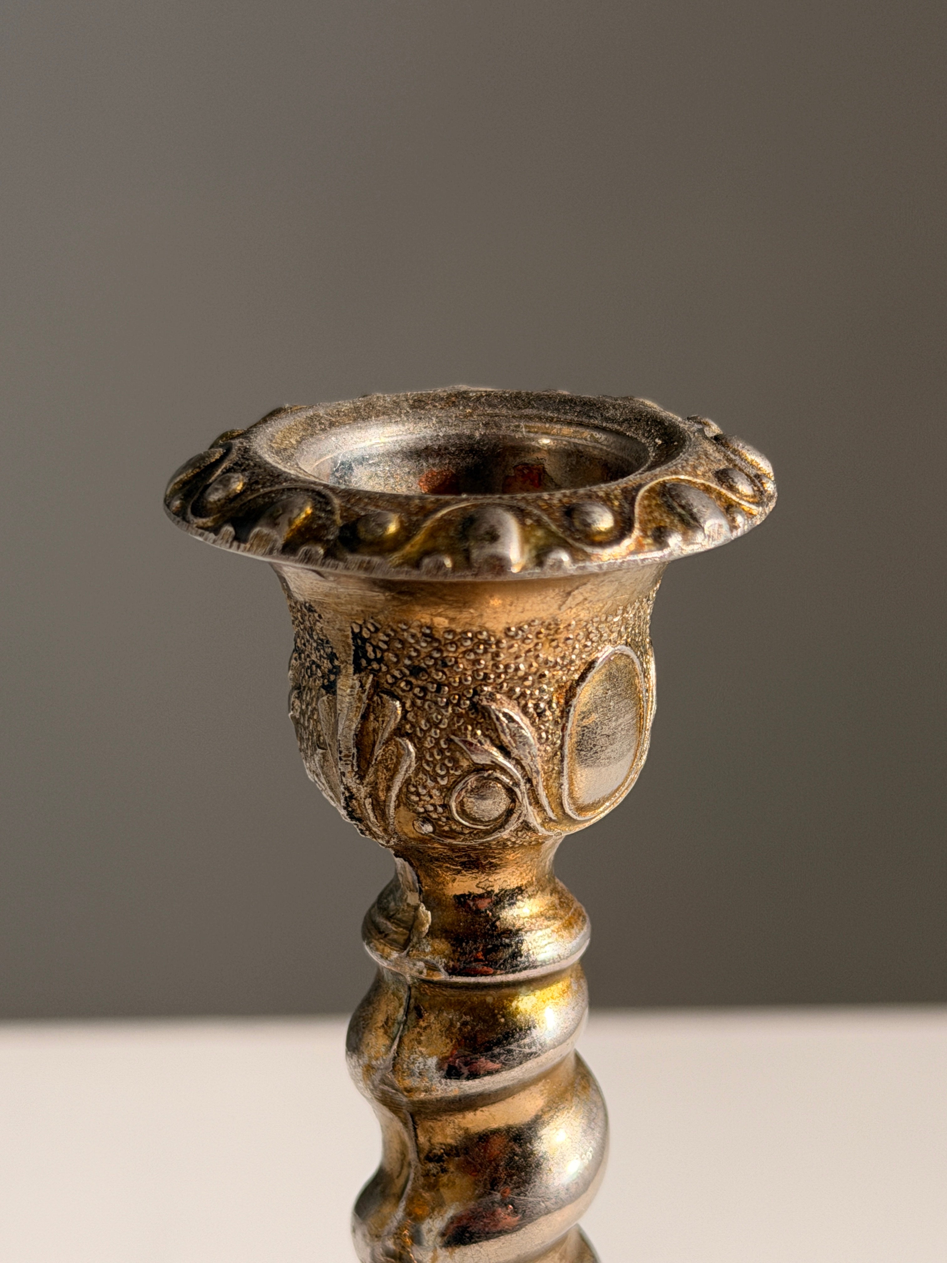Pair of silver-plated candle holders, England — lifestyle setting