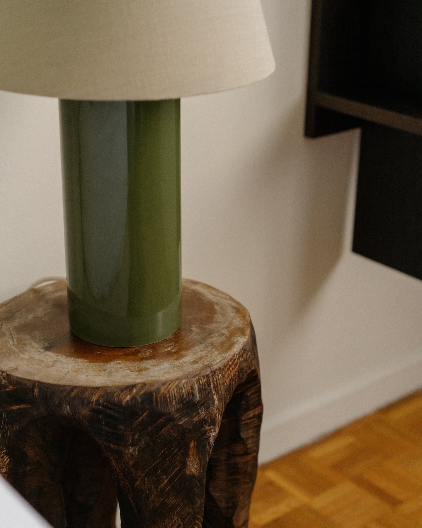 Giro Table Lamp - Treetop & Beige - angled view on wooden side table