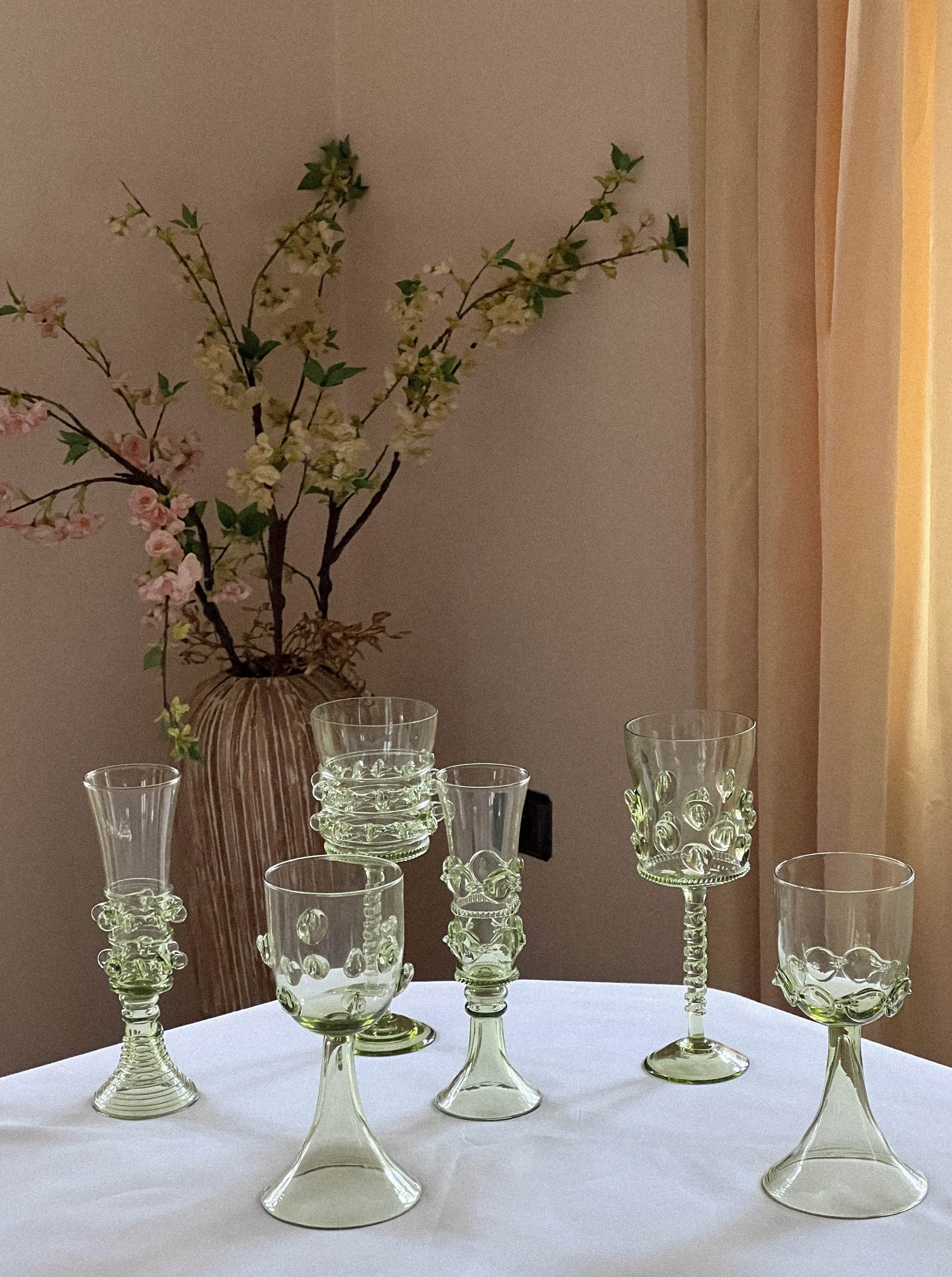 Set of six Mouthblown Wine Glasses — arranged on white table with floral backdrop