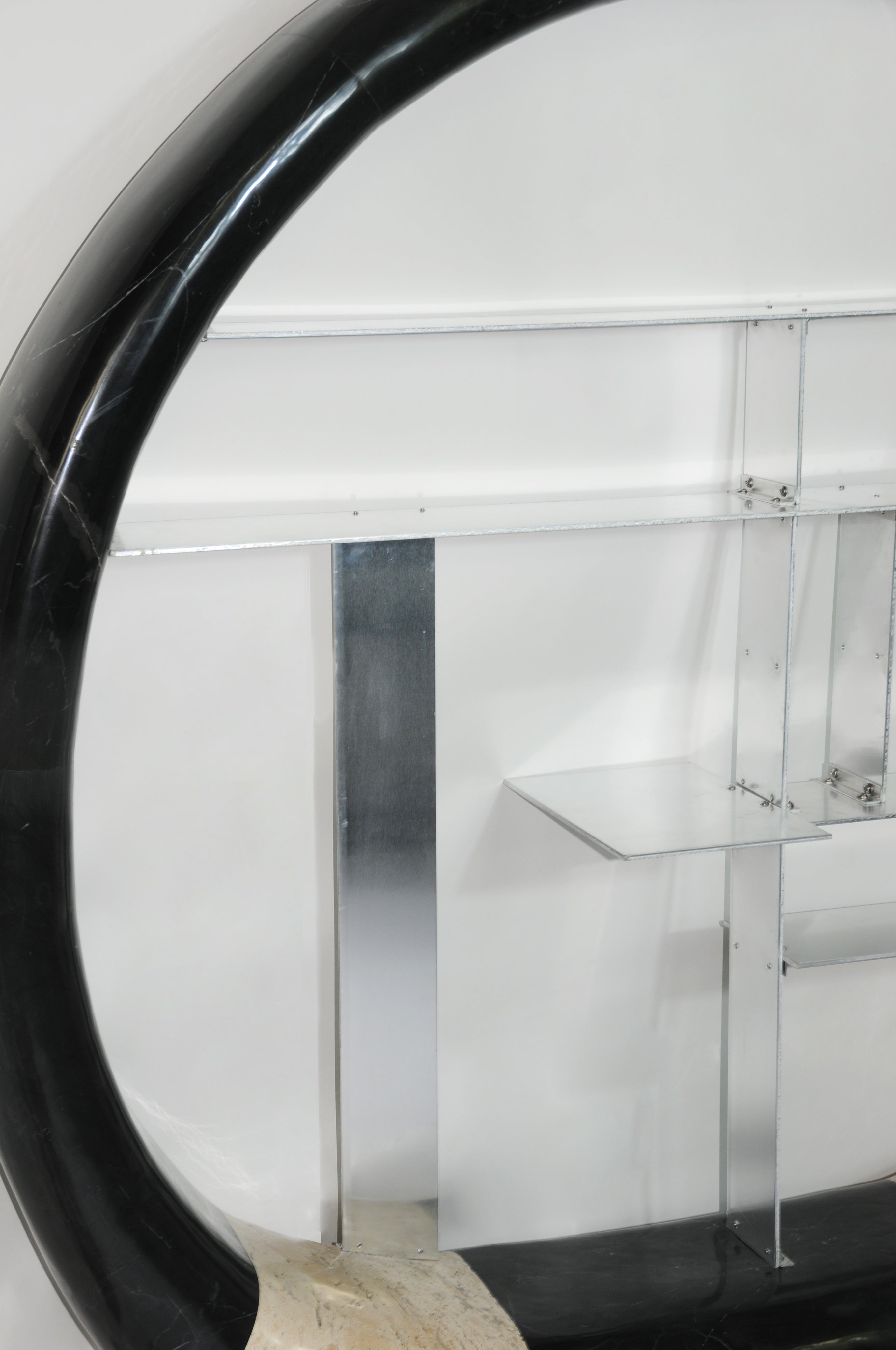 Asymmetric Stone Ring Shelf, Postmodern — angled view with black marble and metal details