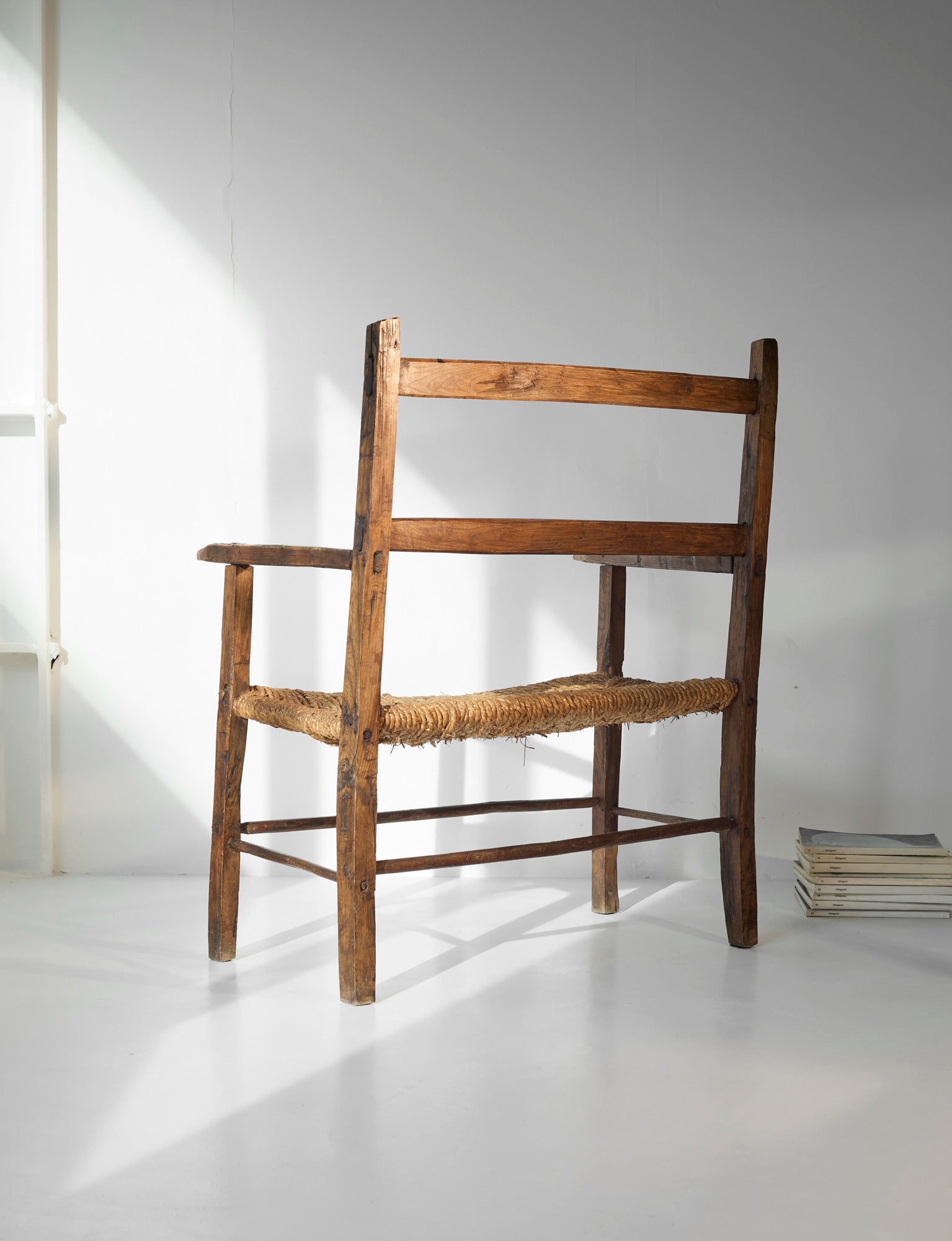 A French folk bench from the 19th Century. Wood and straw — alternate view