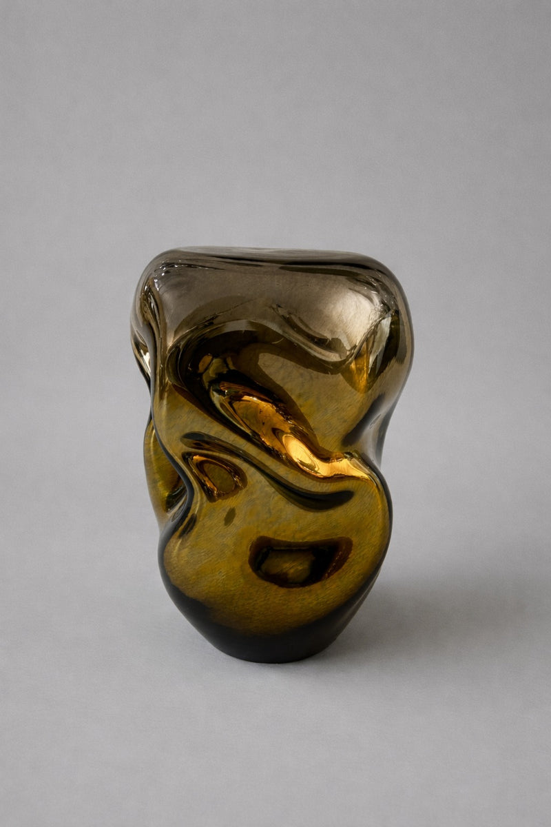 Wave Stool / Side Table XIII — close-up of amber glass surface