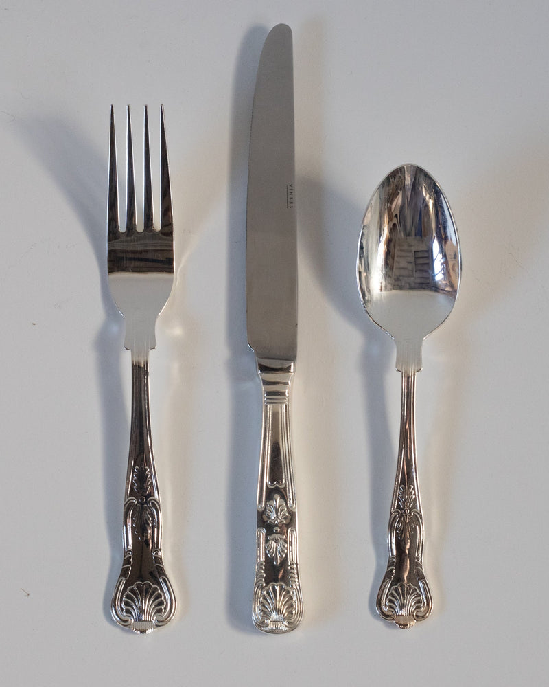 100 Piece Silver Plate Cutlery Set - Viners Shell Motif — close-up of fork, knife, and spoon handles