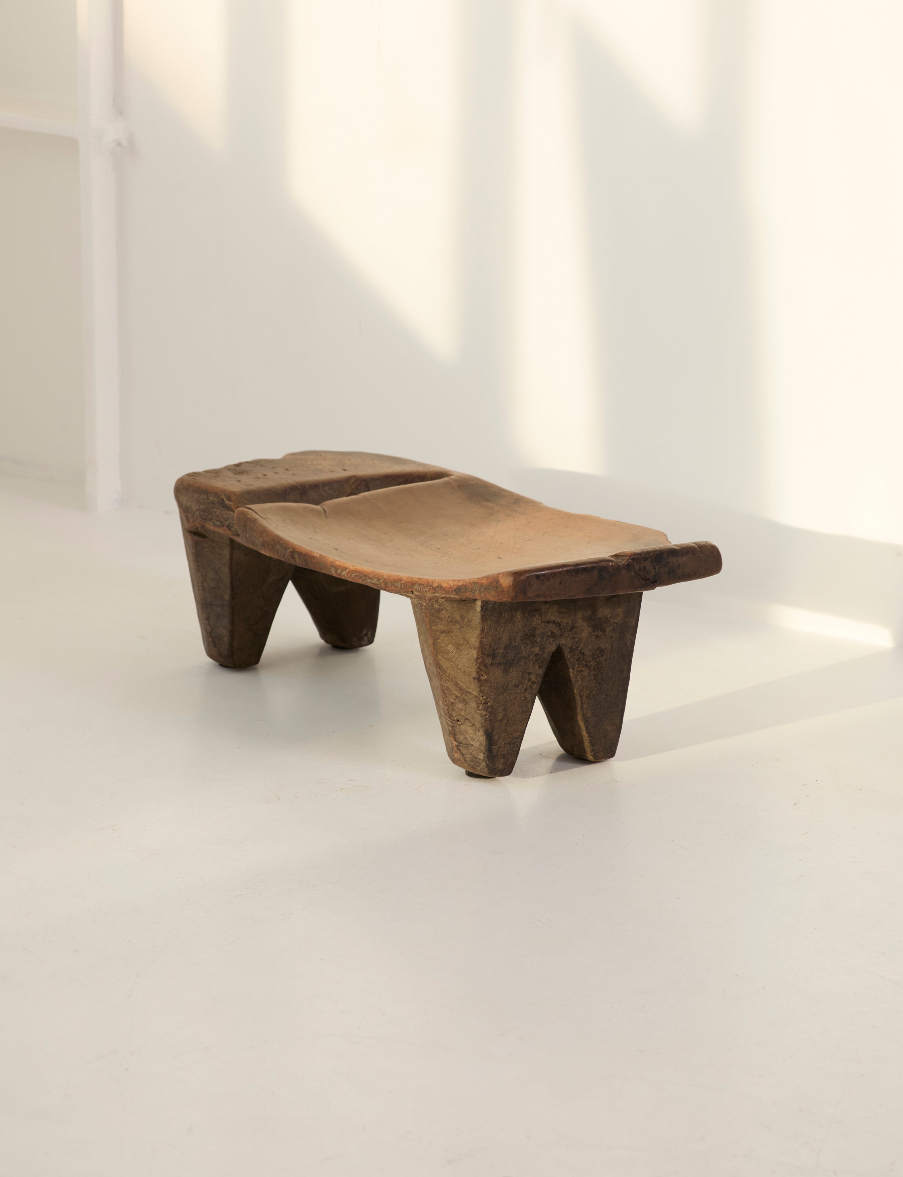 Mid-Century African Senufo Stool in Solid Wood — back view highlighting angular legs