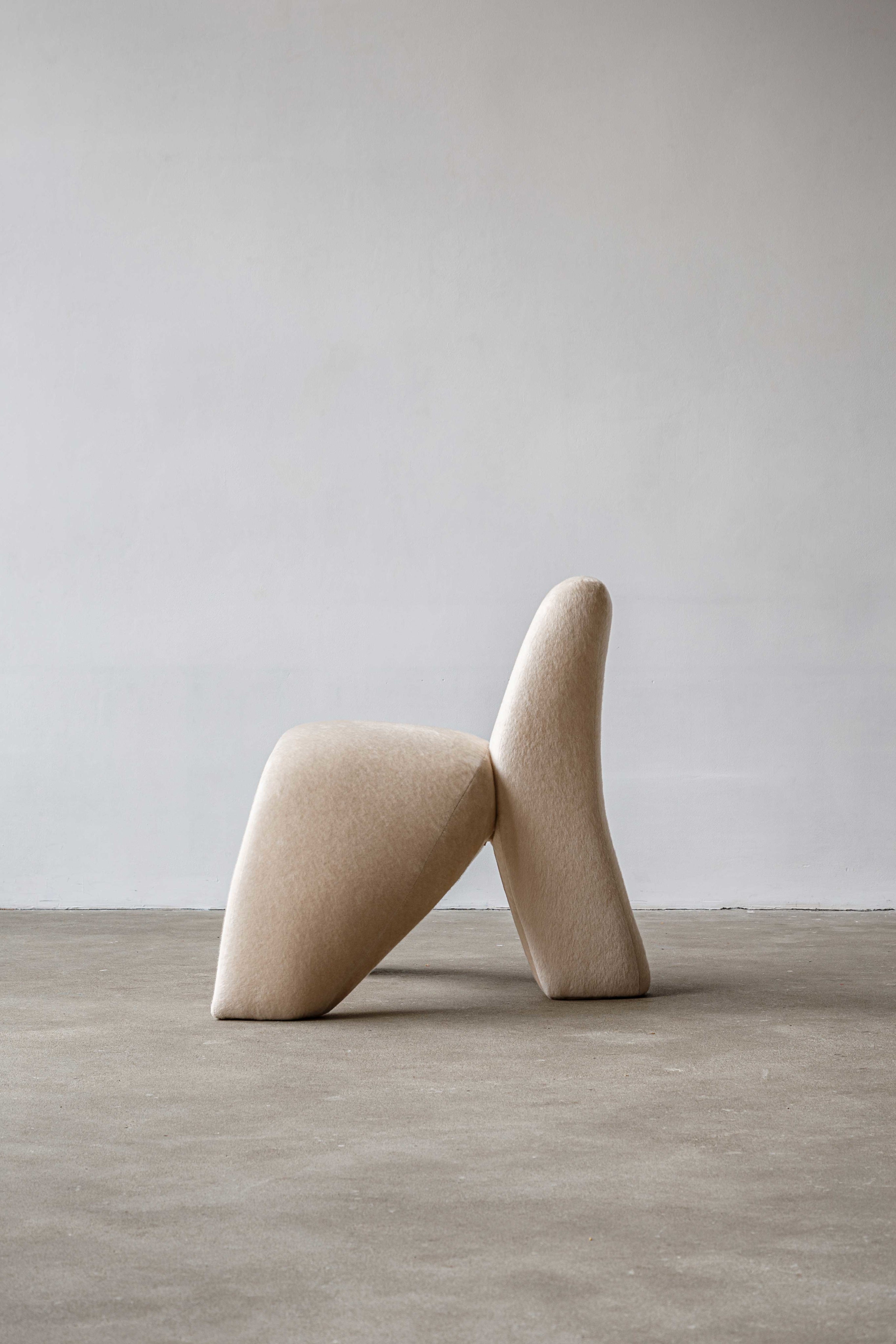 Sokil armchair — angled view of soft beige fabric design