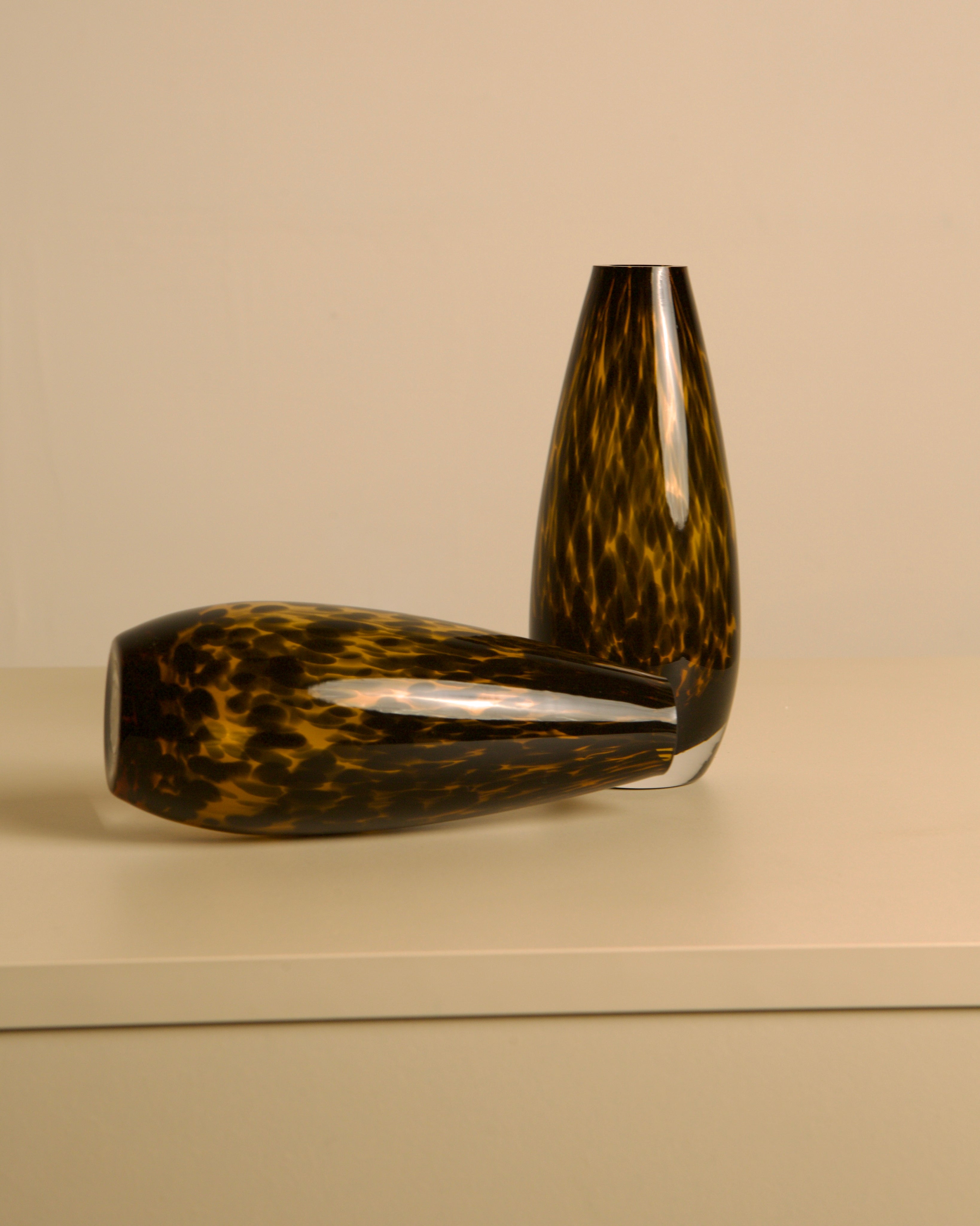 Pair of "Leopard" Murano Glass Vases from the 1980s — angled view on neutral surface